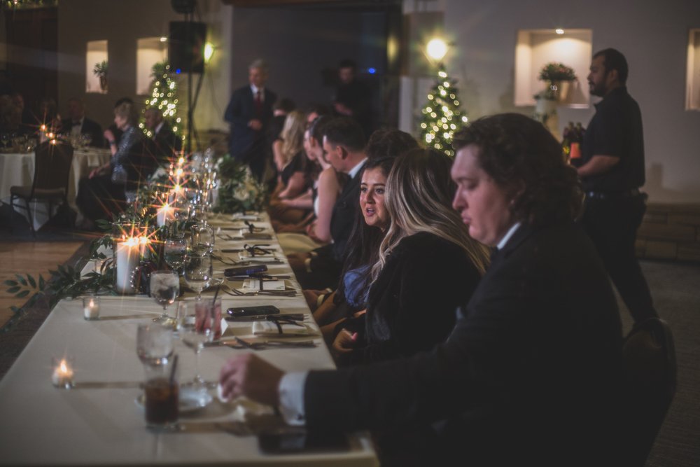  Guests enjoy dinner at Christmas theme wedding reception at Grayhawk Golf Club by Scottsdale Wedding Photographer Jennifer Lind Schutsky. 