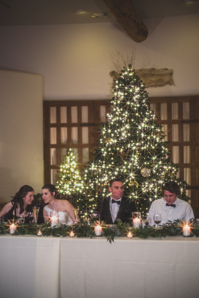  Guests enjoy dinner at Christmas theme wedding reception at Grayhawk Golf Club by Scottsdale Wedding Photographer Jennifer Lind Schutsky. 