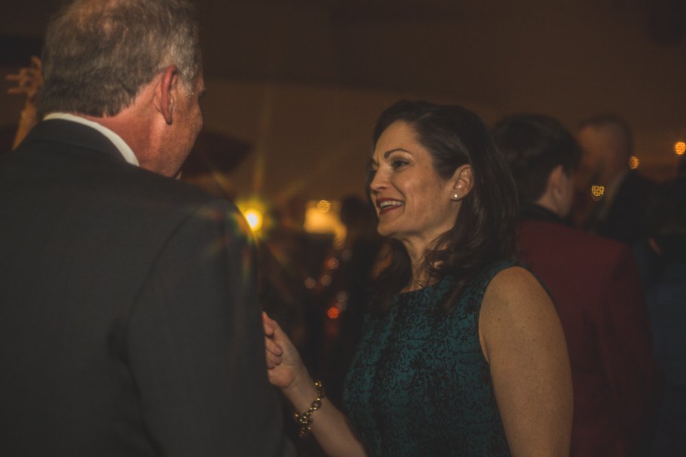  Guests dance at Christmas theme wedding reception at Grayhawk Golf Club by Scottsdale Wedding Photographer Jennifer Lind Schutsky. 