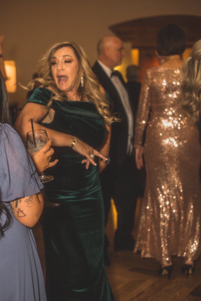  Guests dance at Christmas theme wedding reception at Grayhawk Golf Club by Scottsdale Wedding Photographer Jennifer Lind Schutsky. 