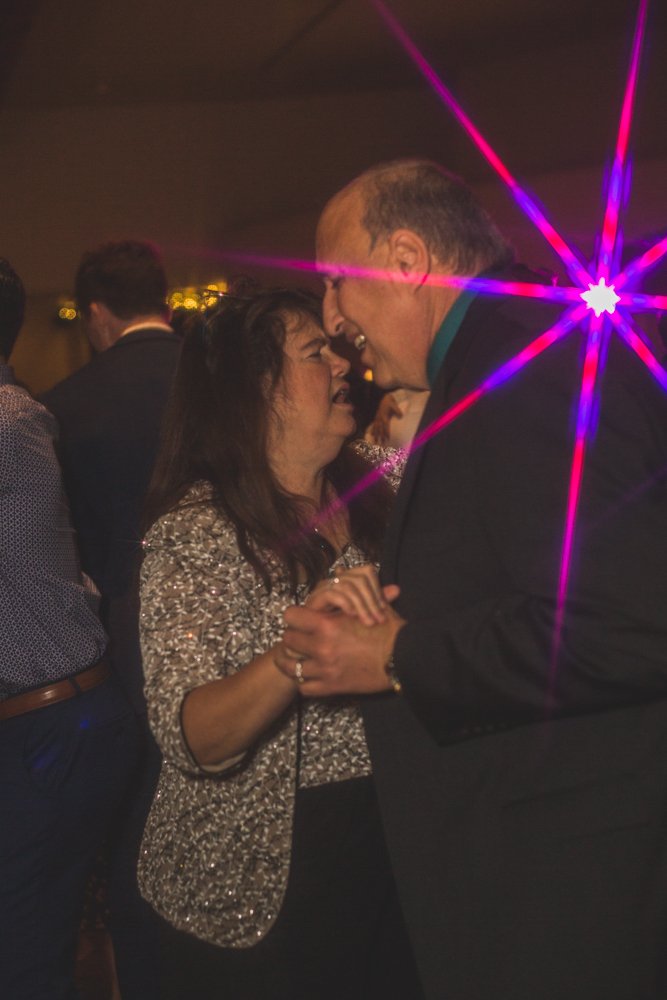  Guests celebrate at Christmas theme wedding reception at Grayhawk Golf Club by Scottsdale Wedding Photographer Jennifer Lind Schutsky. 