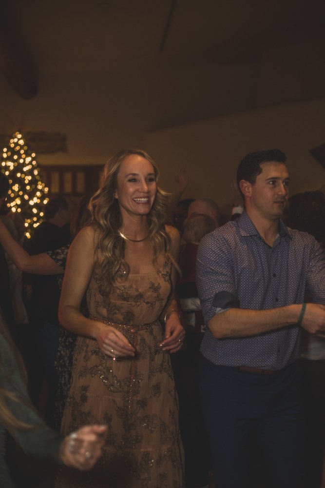  Guests celebrate at Christmas theme wedding reception at Grayhawk Golf Club by Scottsdale Wedding Photographer Jennifer Lind Schutsky. 