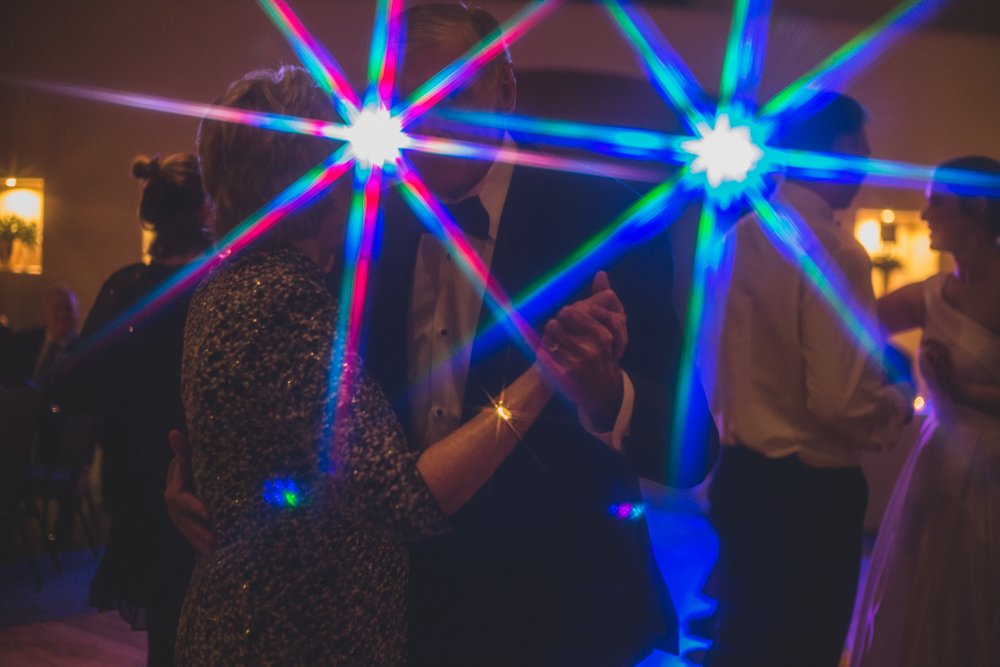  Guests celebrate at Christmas theme wedding reception at Grayhawk Golf Club by Scottsdale Wedding Photographer Jennifer Lind Schutsky. 