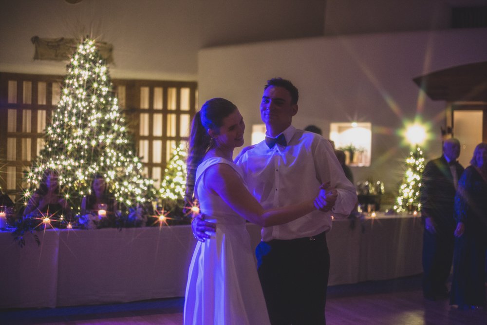  Bride and Groom celebrate at Christmas theme wedding reception at Grayhawk Golf Club by Scottsdale Wedding Photographer Jennifer Lind Schutsky. 