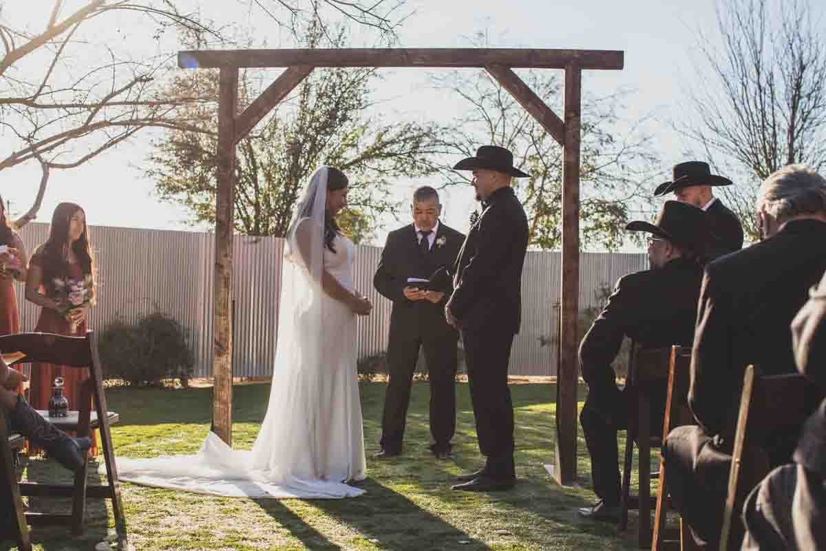  Bride and her father walking down the aisle at Mexican Cowboy / Vaquero Farm Wedding at the Big Red Barn wedding at Schnepf Farms in Queen Creek, Arizona by Arizona based Photographer, Jennifer Lind Schutsky. 