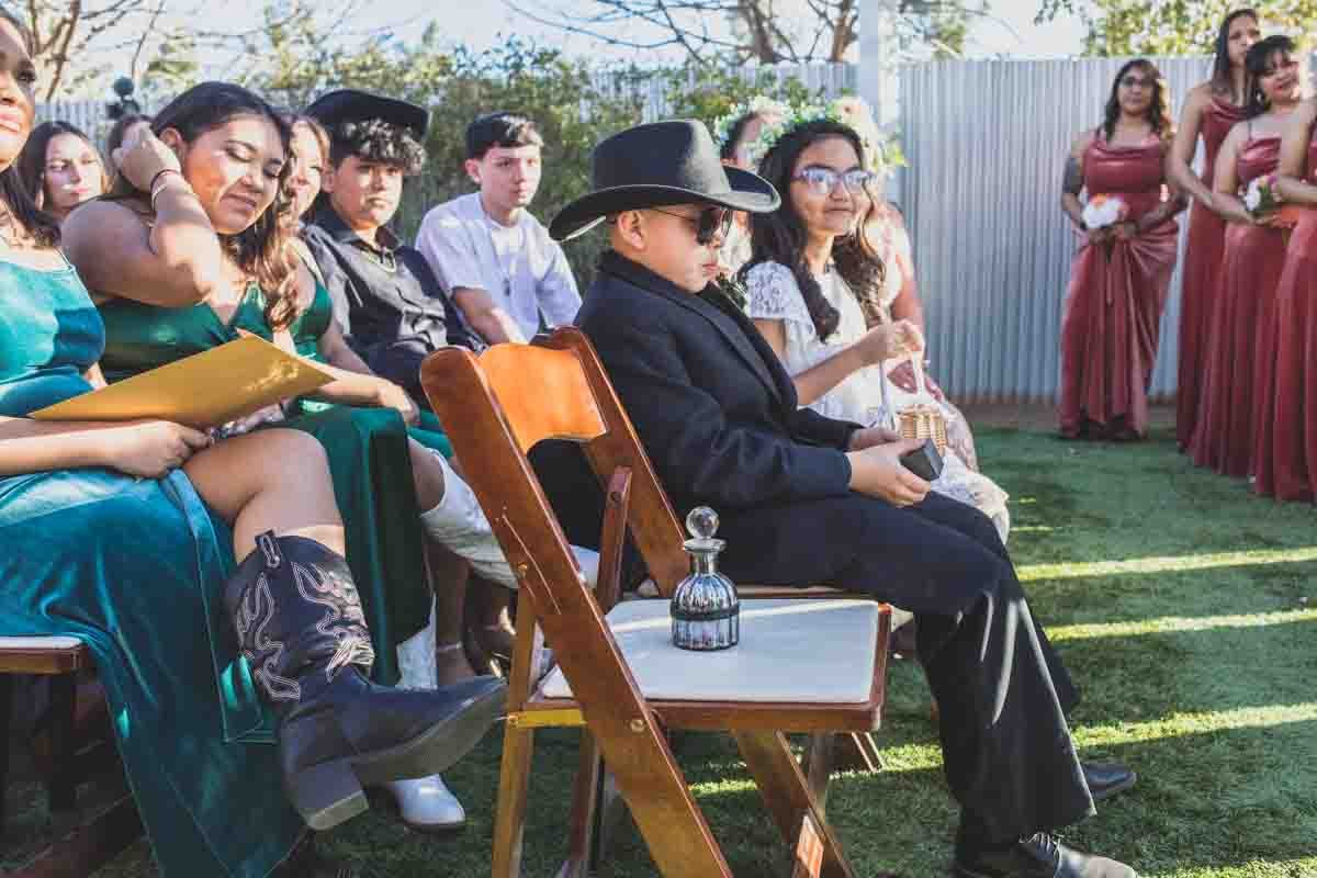  Guests at Mexican Cowboy / Vaquero Farm Wedding at the Big Red Barn wedding at Schnepf Farms in Queen Creek, Arizona by Arizona based Photographer, Jennifer Lind Schutsky. 