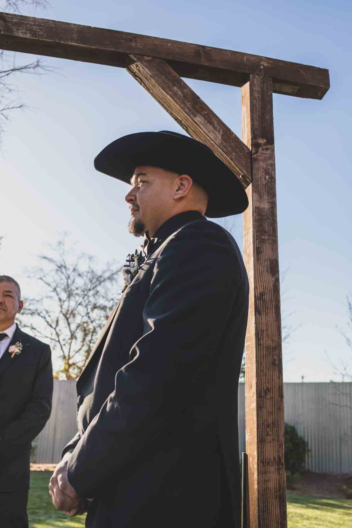  Groom reads his vows at Mexican Cowboy / Vaquero Farm Wedding at the Big Red Barn wedding at Schnepf Farms in Queen Creek, Arizona by Arizona based Photographer, Jennifer Lind Schutsky. 