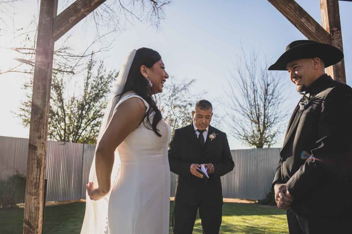  Bride and Groom at Mexican Cowboy / Vaquero Farm Wedding at the Big Red Barn wedding at Schnepf Farms in Queen Creek, Arizona by Arizona based Photographer, Jennifer Lind Schutsky. 