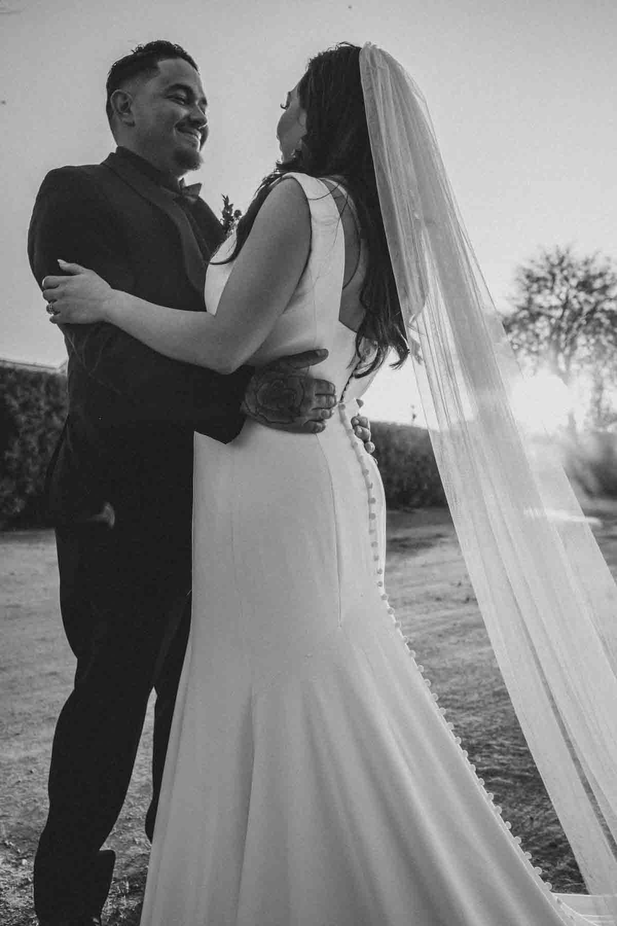  Bride and Groom at Mexican Cowboy / Vaquero Farm Wedding at the Big Red Barn wedding at Schnepf Farms in Queen Creek, Arizona by Arizona based Photographer, Jennifer Lind Schutsky. 