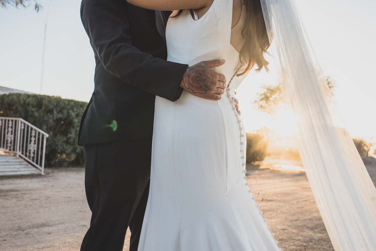  Bride and Groom at Mexican Cowboy / Vaquero Farm Wedding at the Big Red Barn wedding at Schnepf Farms in Queen Creek, Arizona by Arizona based Photographer, Jennifer Lind Schutsky. 