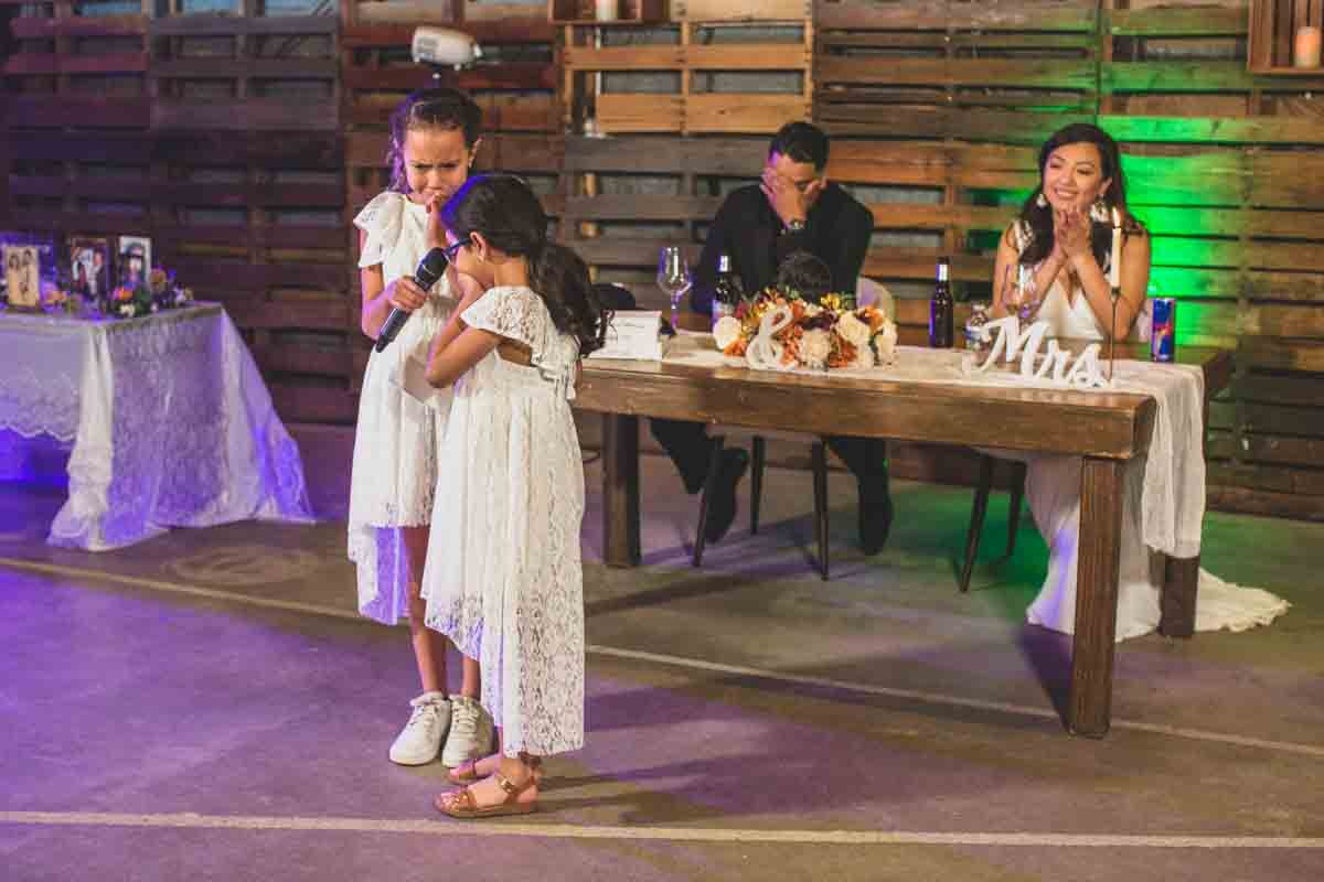  Daughters give toast to their new dad at Wedding Reception Celebration at Mexican Cowboy / Vaquero Farm Wedding at the Big Red Barn wedding at Schnepf Farms in Queen Creek, Arizona by Arizona based Photographer, Jennifer Lind Schutsky. 