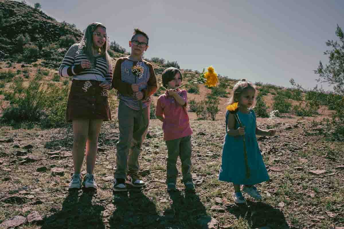  Kids playing in the desert during Creative Photography Family Session with best Phoenix family photographer, Jennifer Lind Schutsky. 