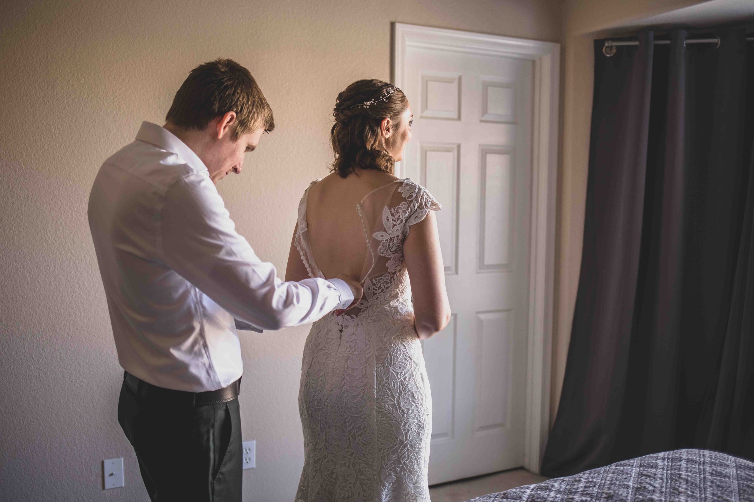  Bride and Groom getting ready together for their wedding day at home by Gilbert Wedding Photographer Jennifer Lind Schutsky. 