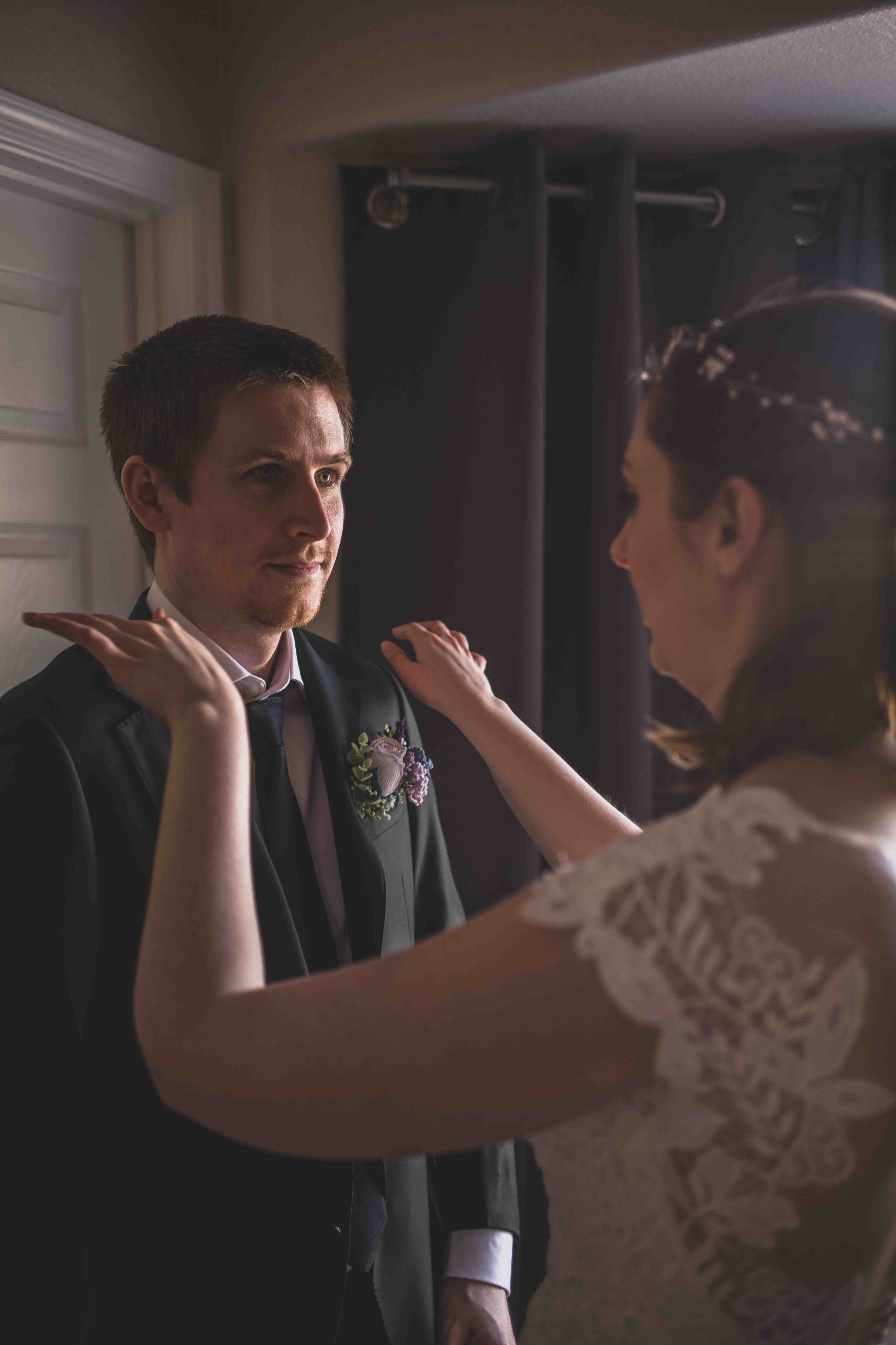 Bride and Groom getting ready together for their wedding day at home by Gilbert, Arizona Wedding Photographer Jennifer Lind Schutsky.