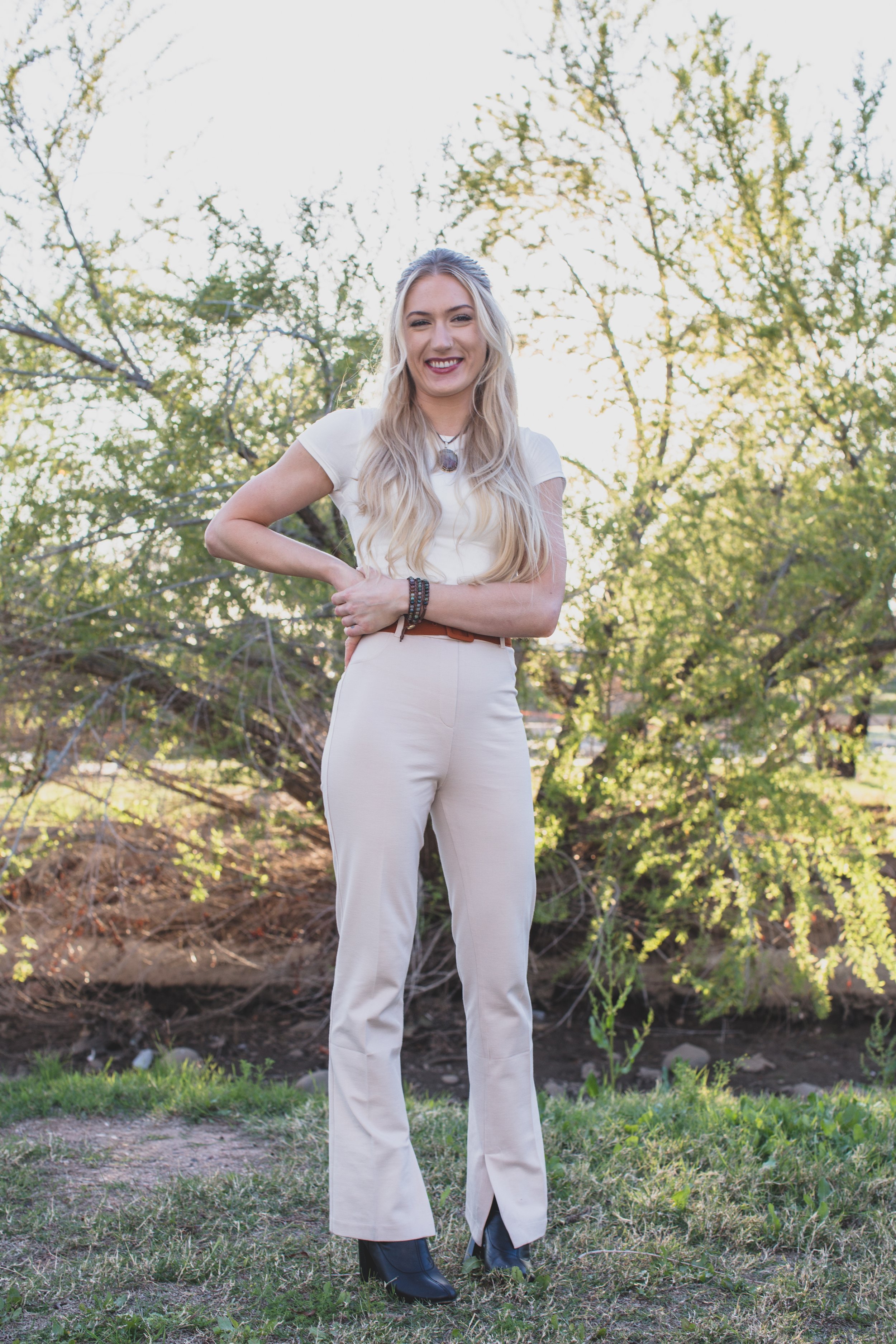  Woman poses in front of natural backdrop for professional headshots by Scottsdale based Corporate Branding Photographer, Jennifer Lind Schutsky in Arizona. 