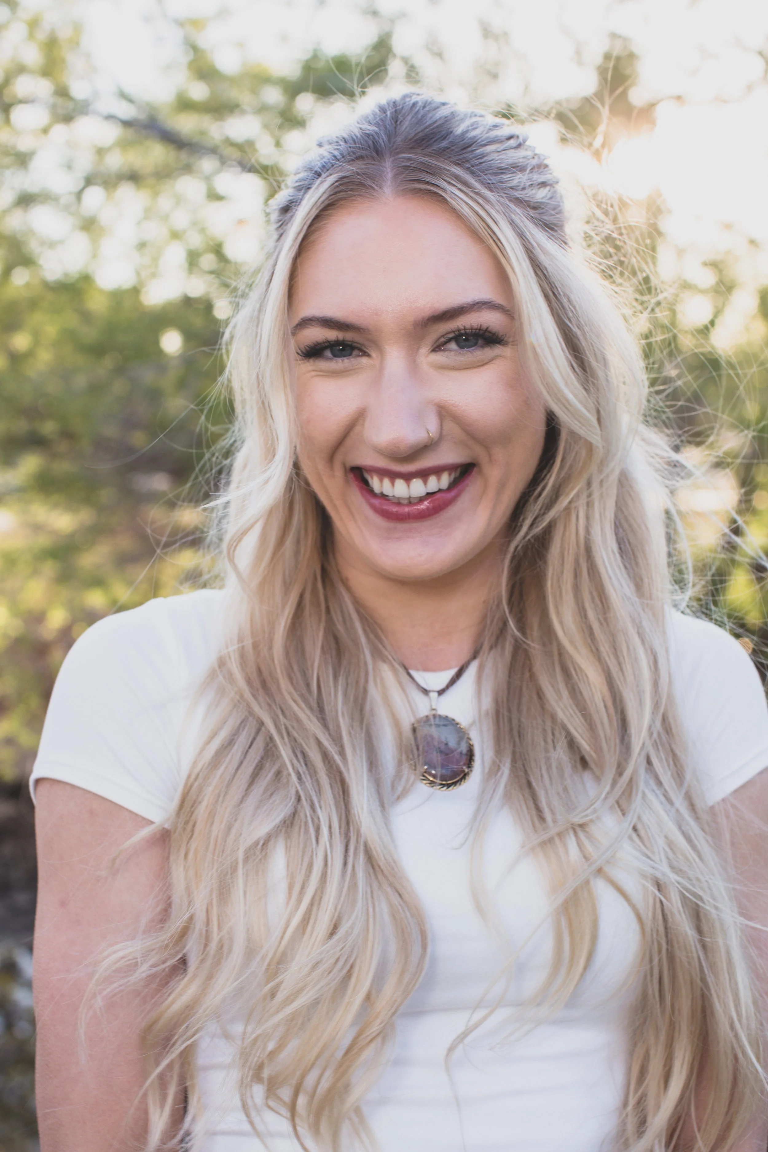 Woman poses in front of natural backdrop for professional headshots by Scottsdale based Corporate Branding Photographer, Jennifer Lind Schutsky in Arizona.