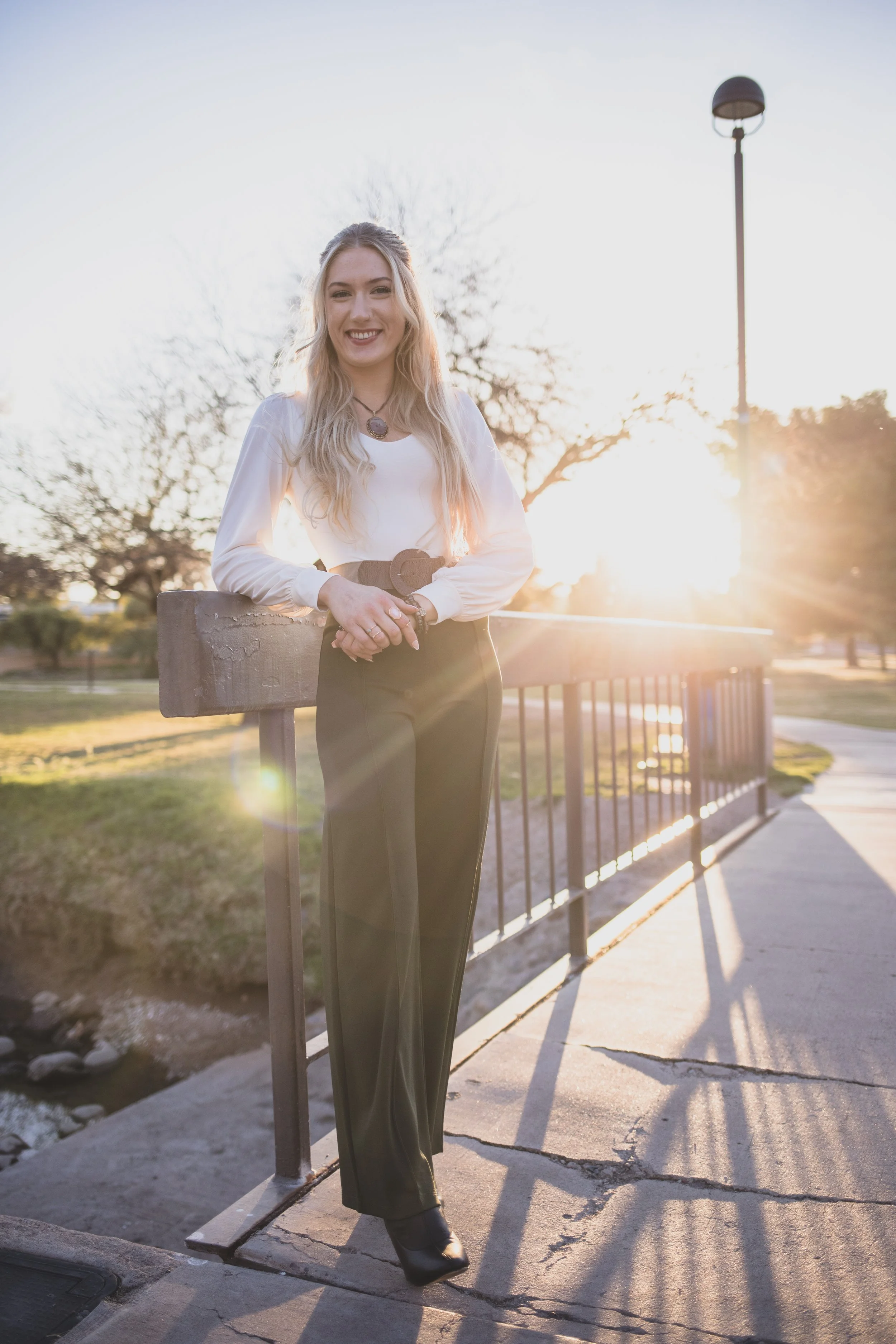 Woman poses in front of natural backdrop for professional headshots by Scottsdale based Corporate Branding Photographer, Jennifer Lind Schutsky in Arizona.