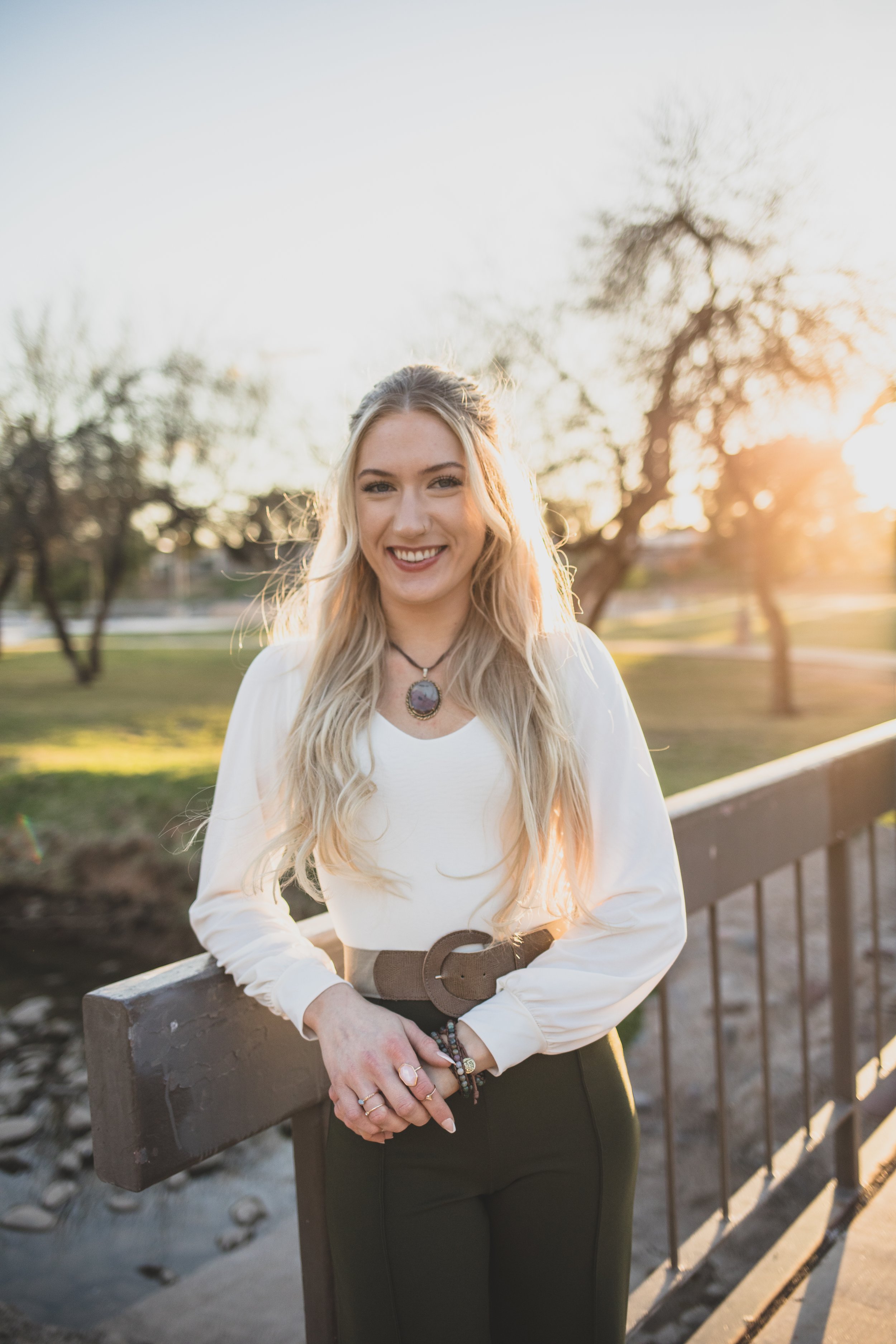 Woman poses in front of natural backdrop for professional headshots by Scottsdale based Corporate Branding Photographer, Jennifer Lind Schutsky in Arizona.