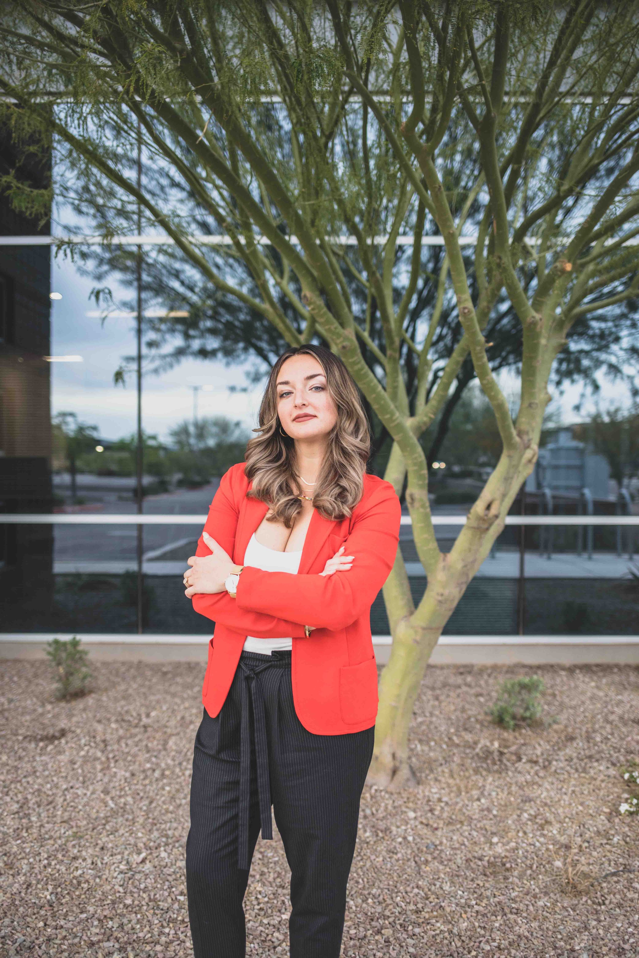 Naturopathic Doctor poses in front of Palo Verde Tree in front of office complex in Gilbert, Arizona by Phoenix based Branding Photographer, Jennifer Lind Schutsky.