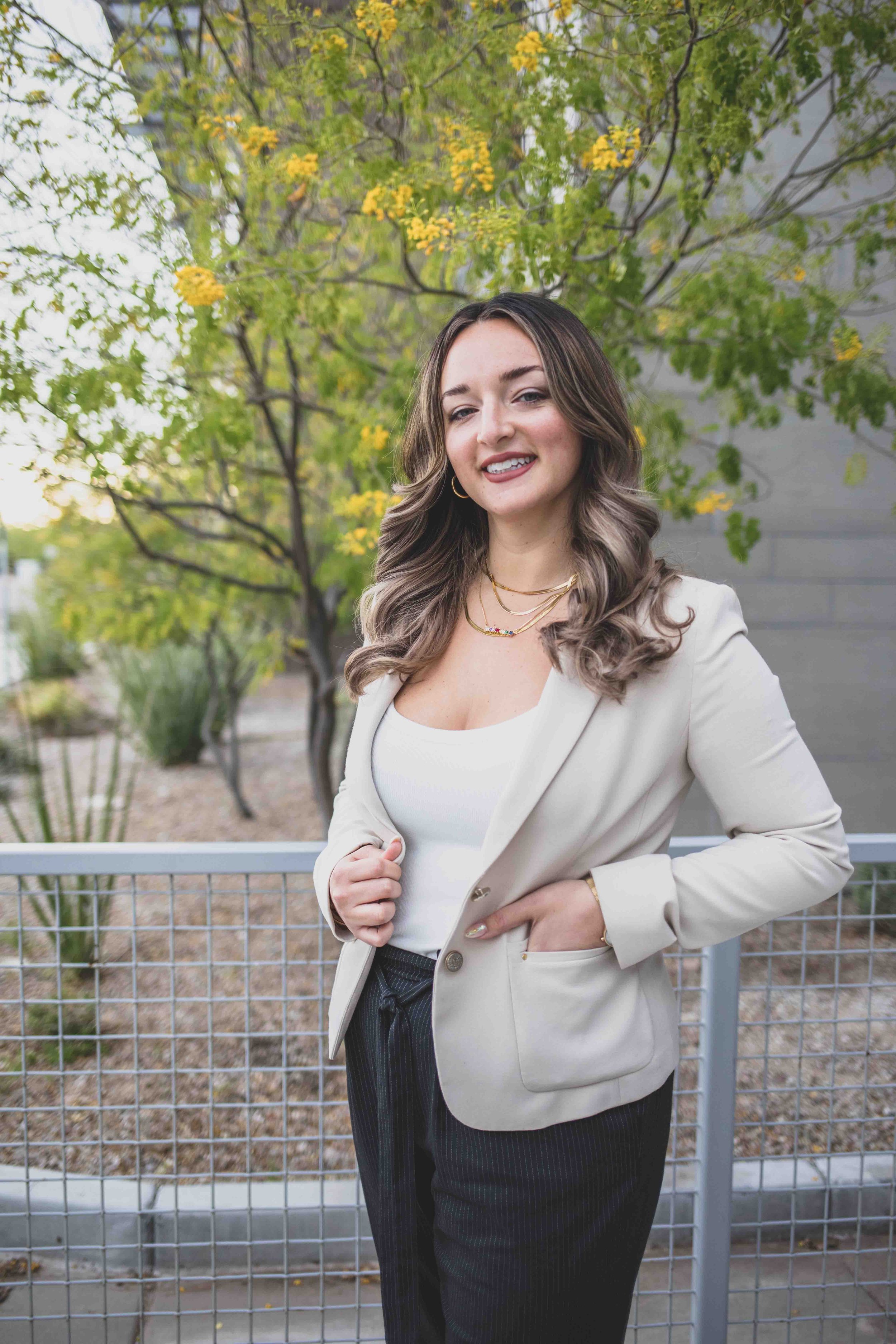 Naturopathic Doctor poses on a patio in front of office complex in Gilbert, Arizona by Gilbert Branding Photographer, Jennifer Lind Schutsky.