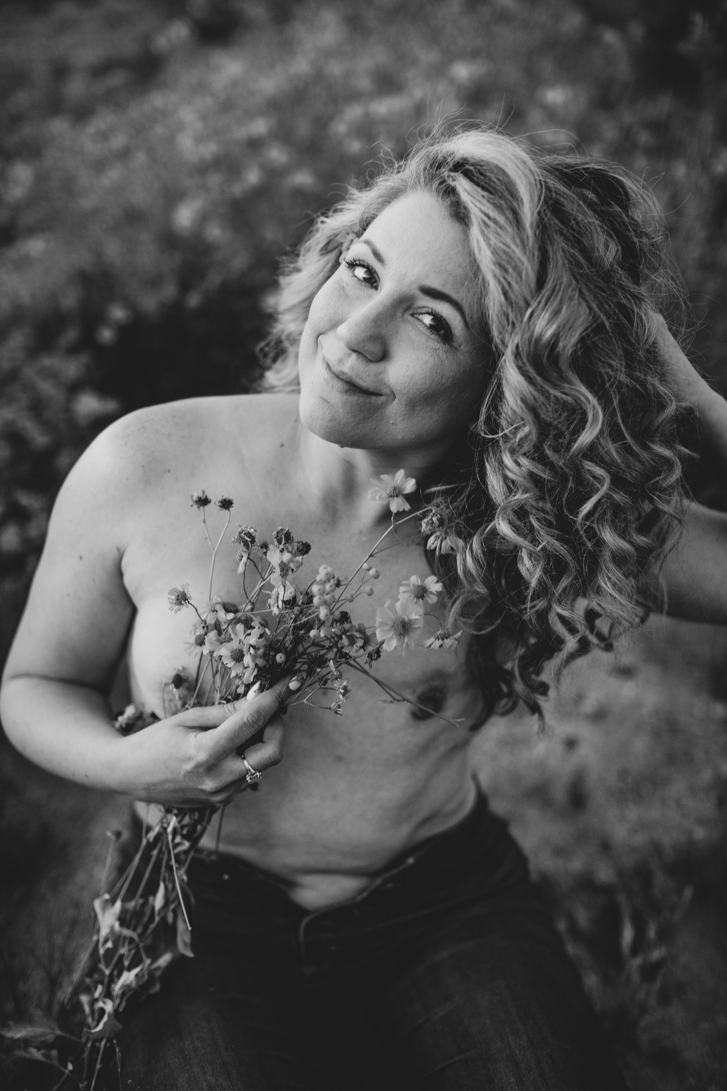 Breast Cancer survivor and thriver poses for wildflower desert boudoir session with Arizona creative boudoir photographer; Jennifer Lind Schutsky.