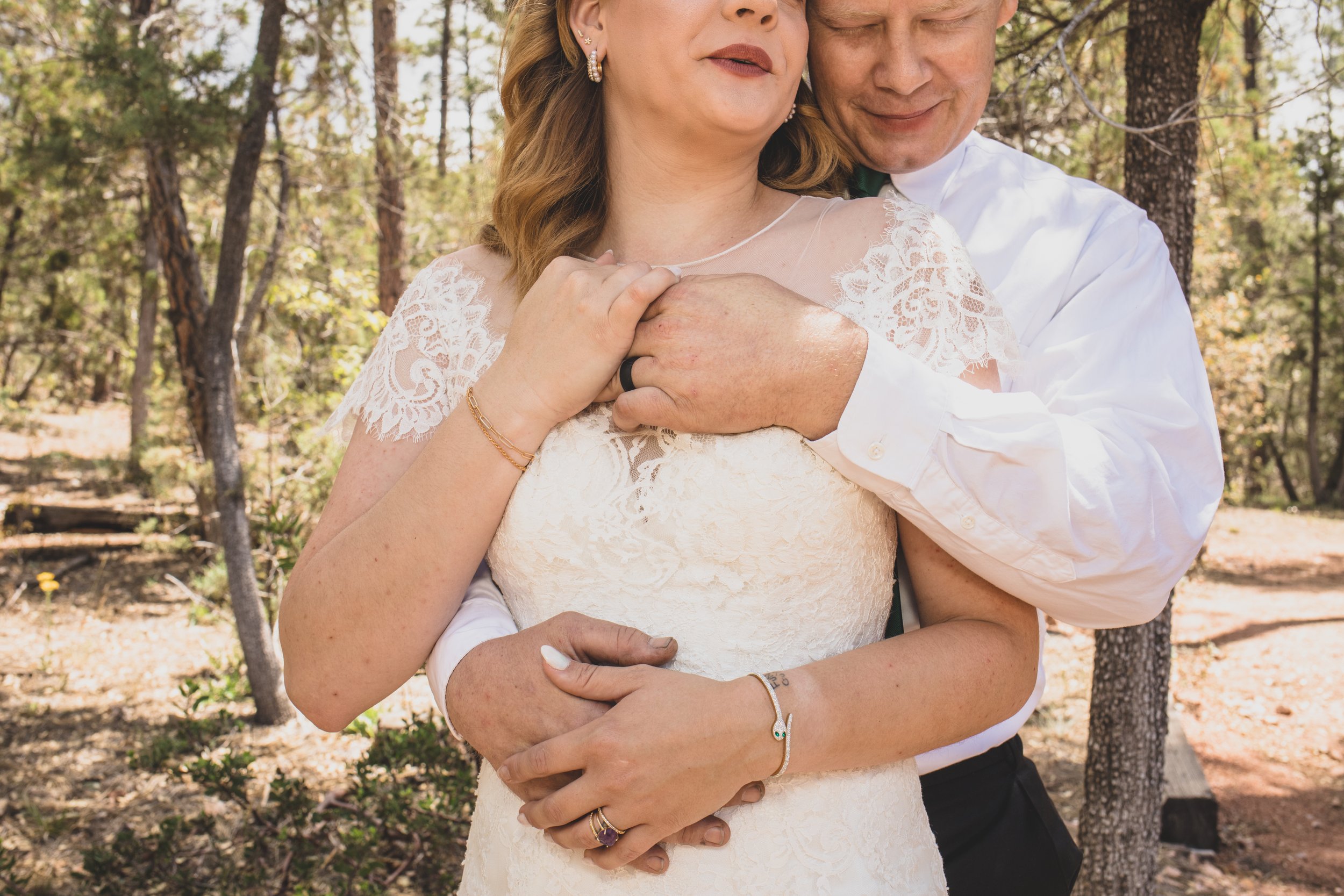 Newlyweds pose for their portraits at high noon in the National Forest in Payson, AZ by the best Arizona Elopement Photographer; Jennifer Lind Schutsky.