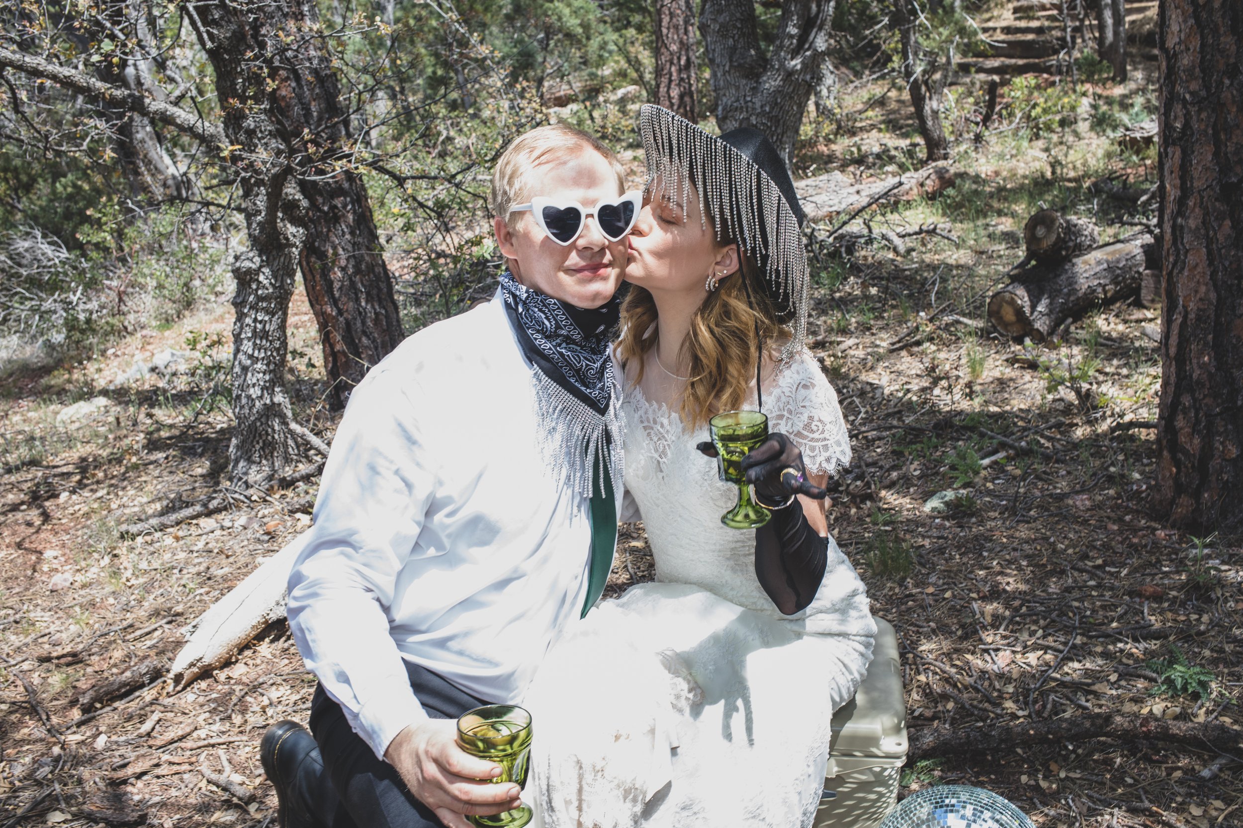 Couple poses for elopement reception in National Forest by all inclusive Arizona Elopement Photographer, Jennifer Lind Schutsky. 
