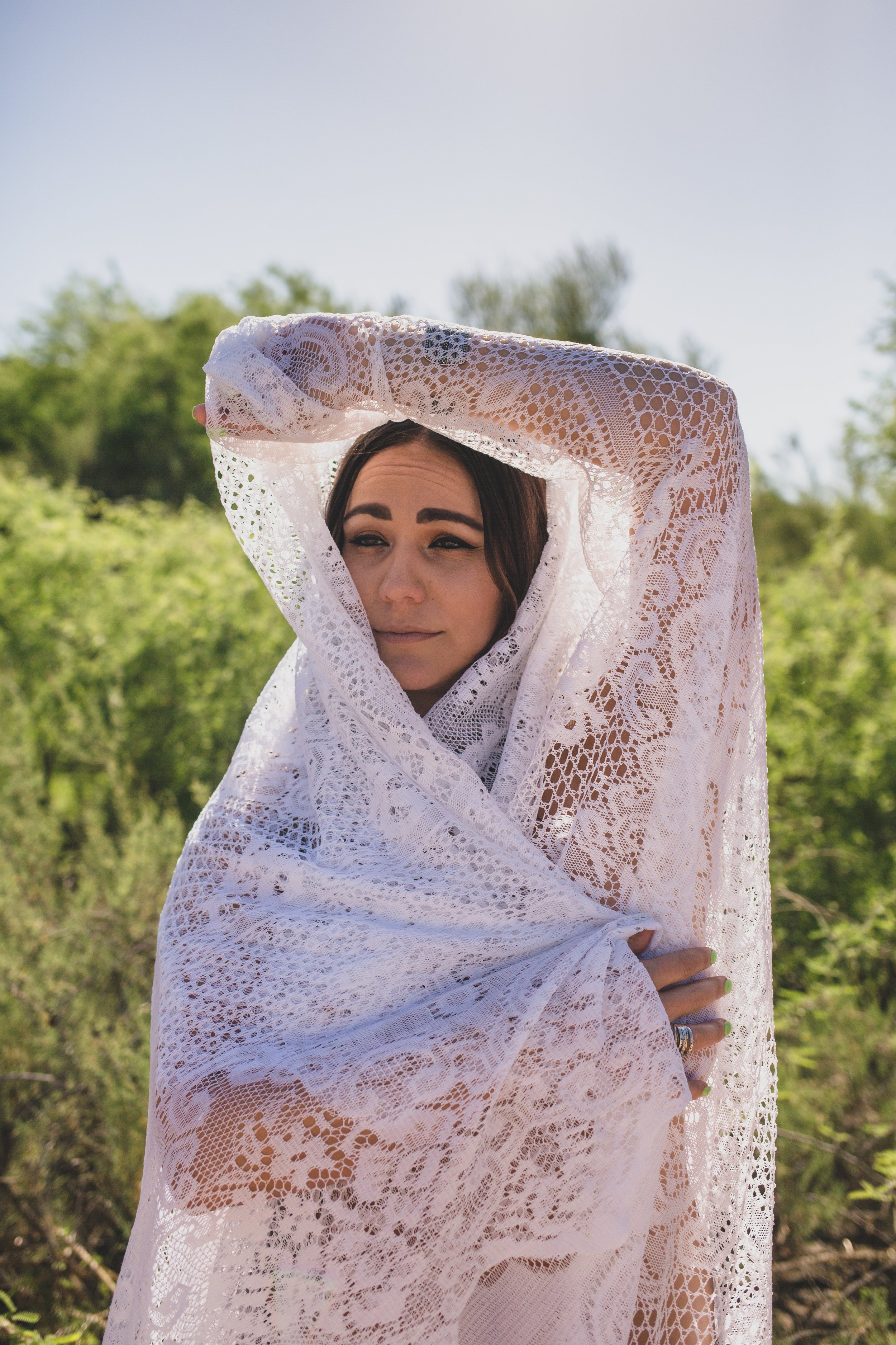 Woman poses for non-traditional boudoir photography at the Salt River, Arizona, by Phoenix Boudoir Photographer Jennifer Lind Schutsky.