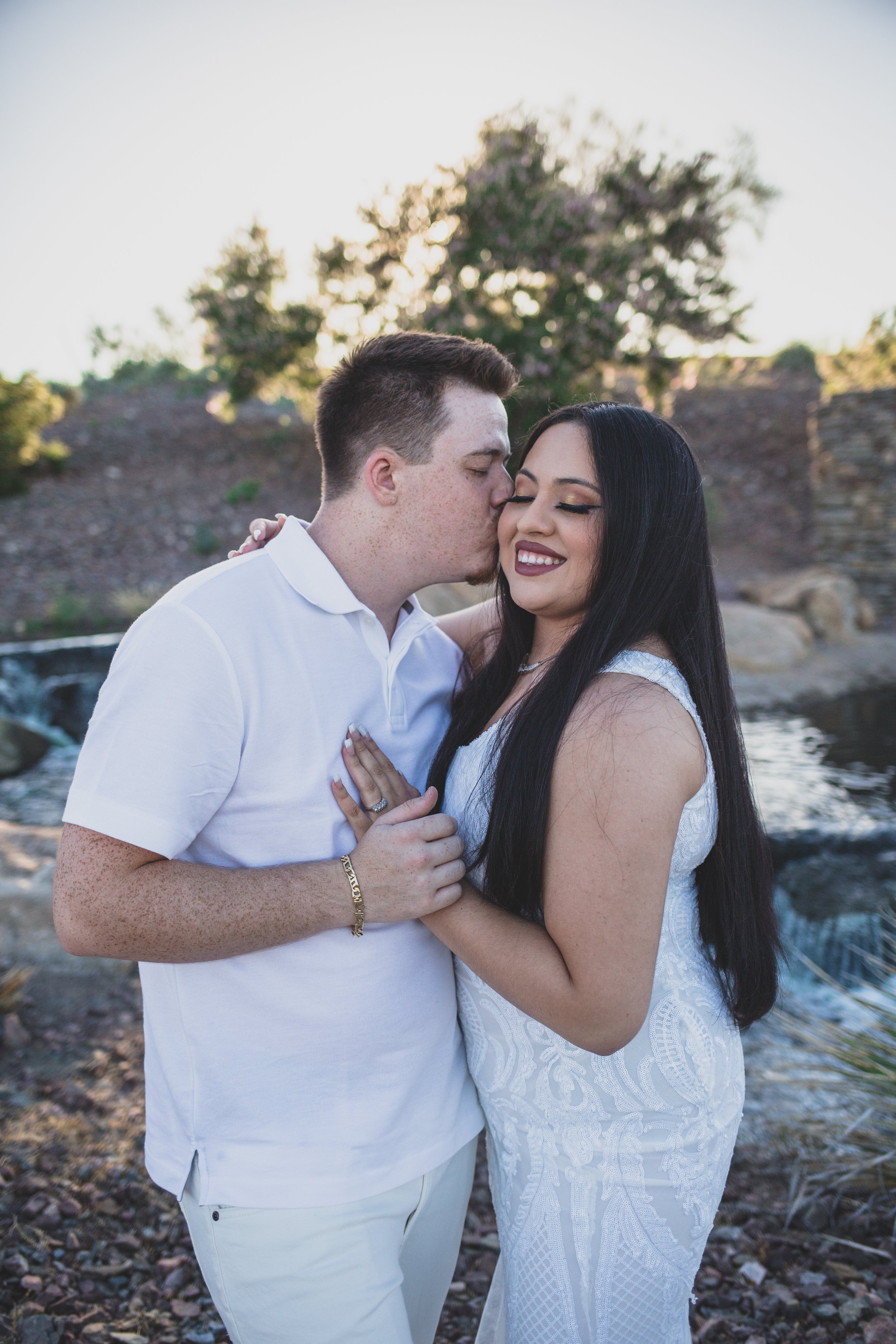 Couple poses for their Estrella Mountain Estates engagement session in Phoenix, Arizona by epic Wedding Photographer; Jennifer Lind Schutsky.