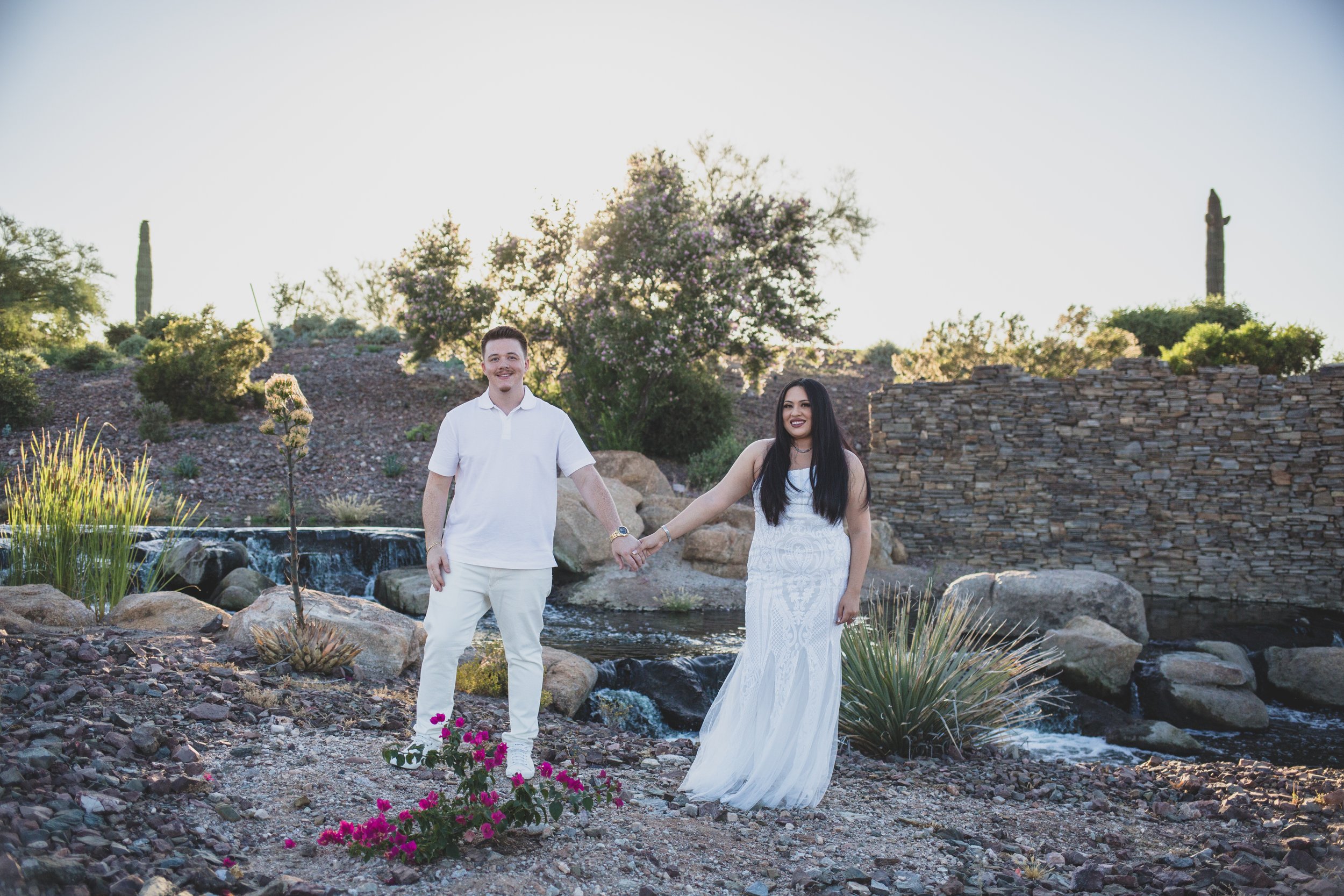 Couple poses for their Estrella Mountain Estates engagement session in Phoenix, Arizona by epic Wedding Photographer; Jennifer Lind Schutsky.