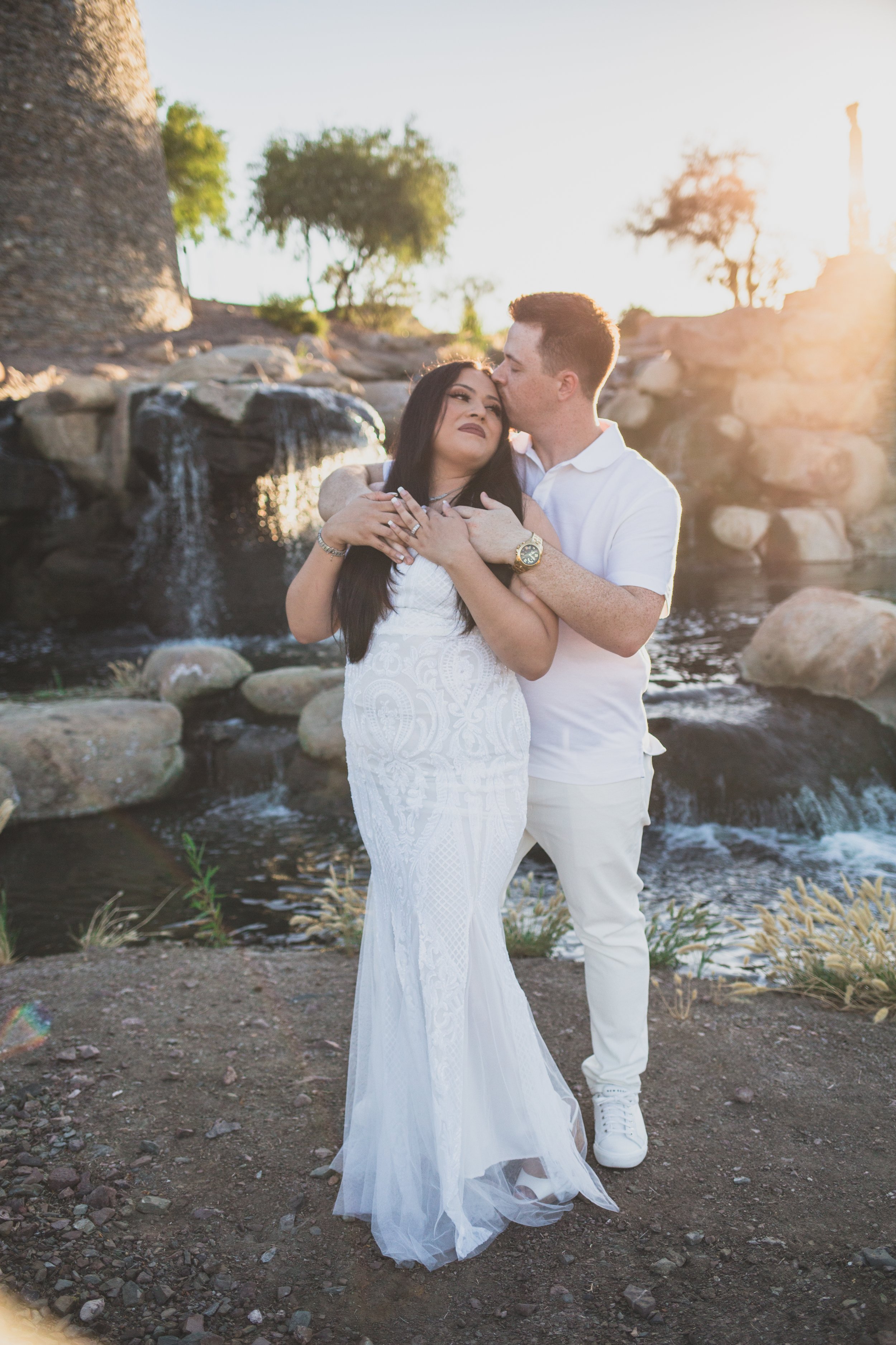 Couple poses together for their Estrella Mountain  engagement session in Phoenix, Arizona by epic Wedding Photographer; Jennifer Lind Schutsky.