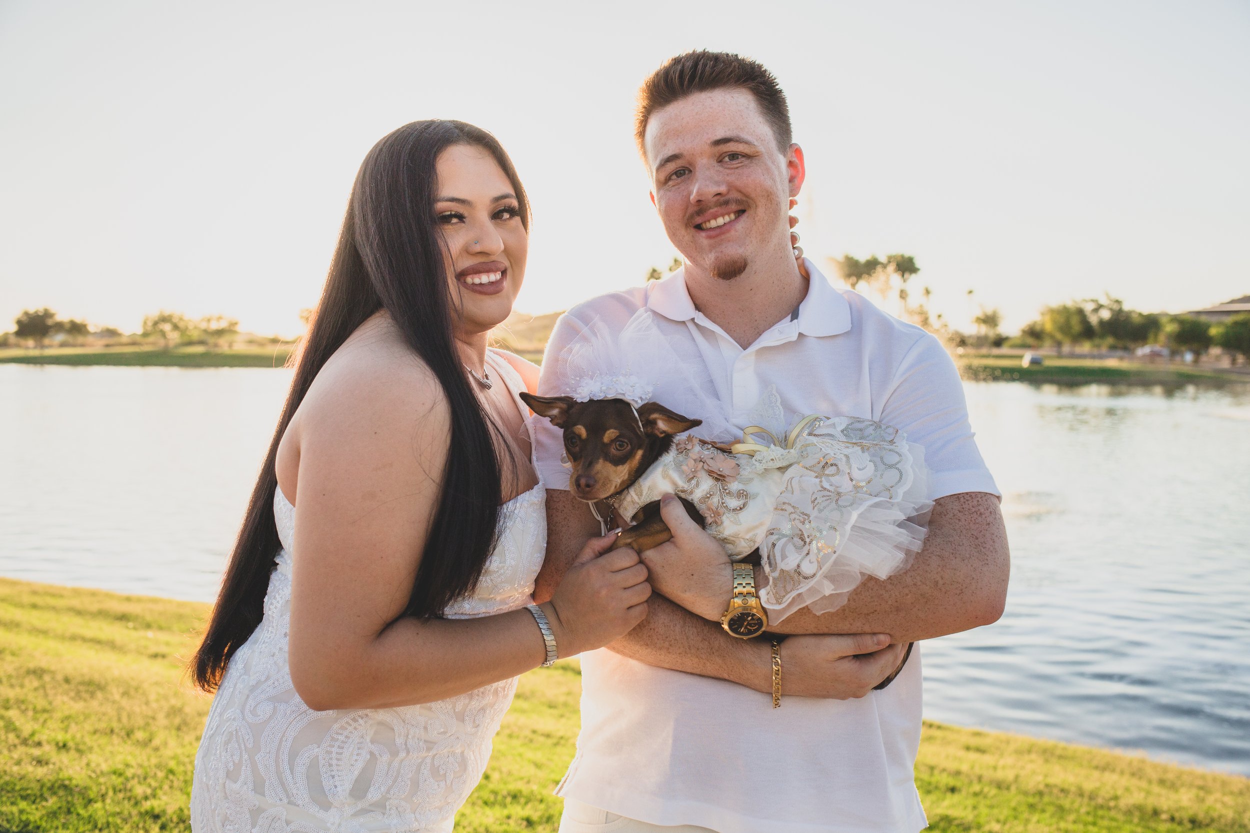 Couple poses together for their Estrella Mountain Lakes engagement session in Phoenix, Arizona by epic Wedding Photographer; Jennifer Lind Schutsky.