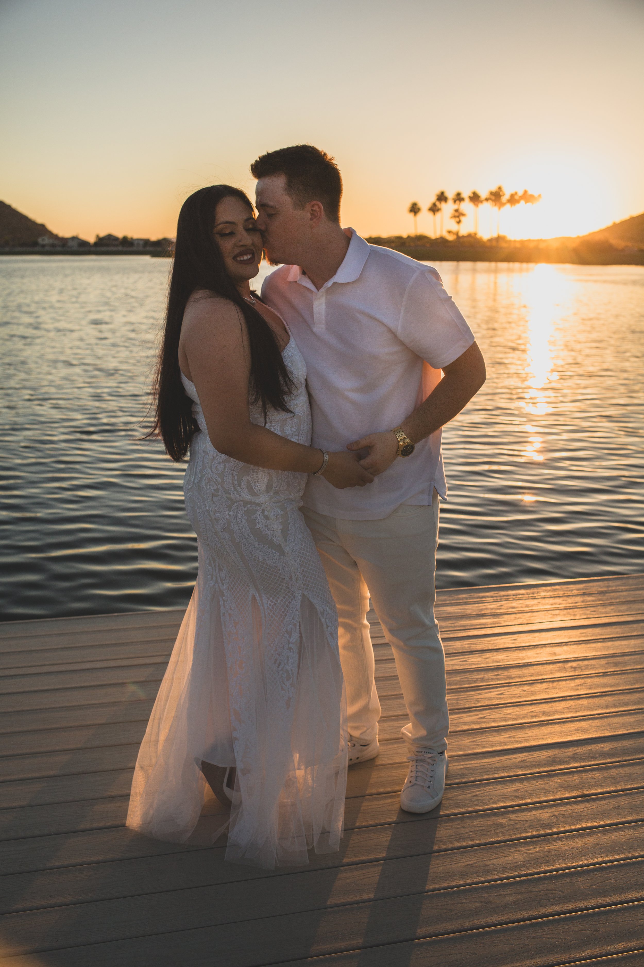 Couple poses together for their Estrella Mountain  engagement session in Phoenix, Arizona by epic Wedding Photographer; Jennifer Lind Schutsky.