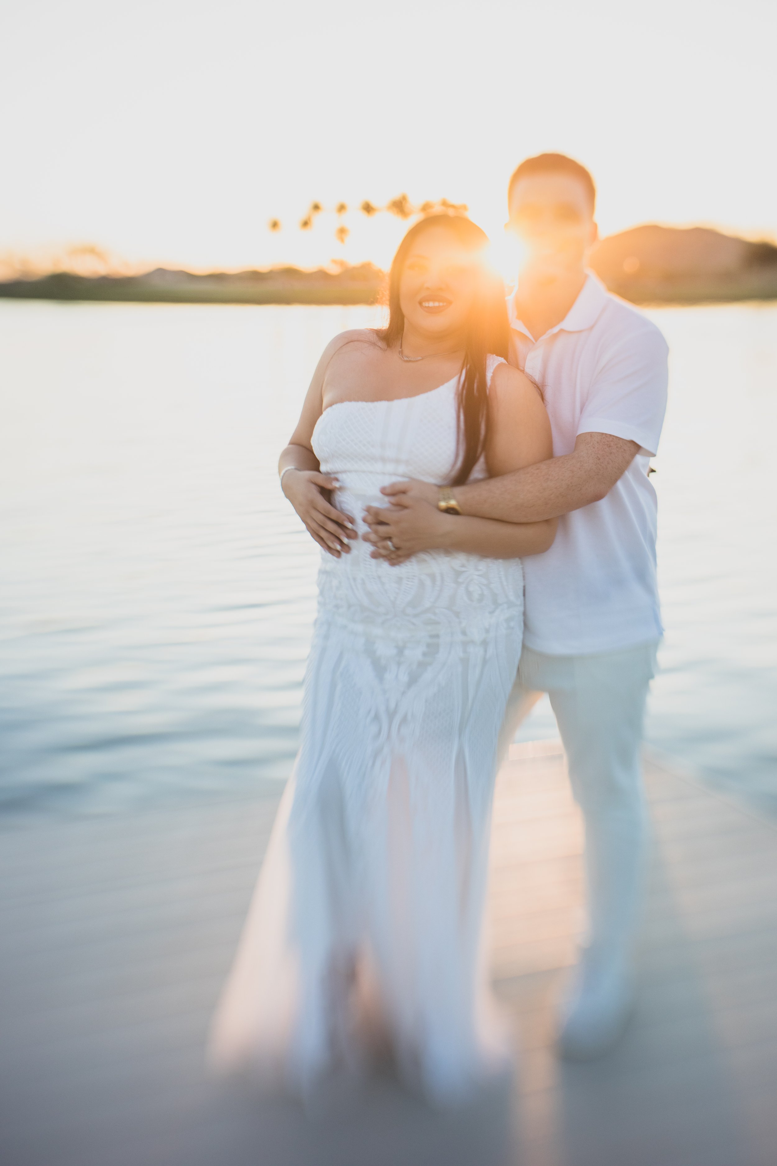 Couple poses together for their Estrella Mountain  engagement session in Phoenix, Arizona by epic Wedding Photographer; Jennifer Lind Schutsky.