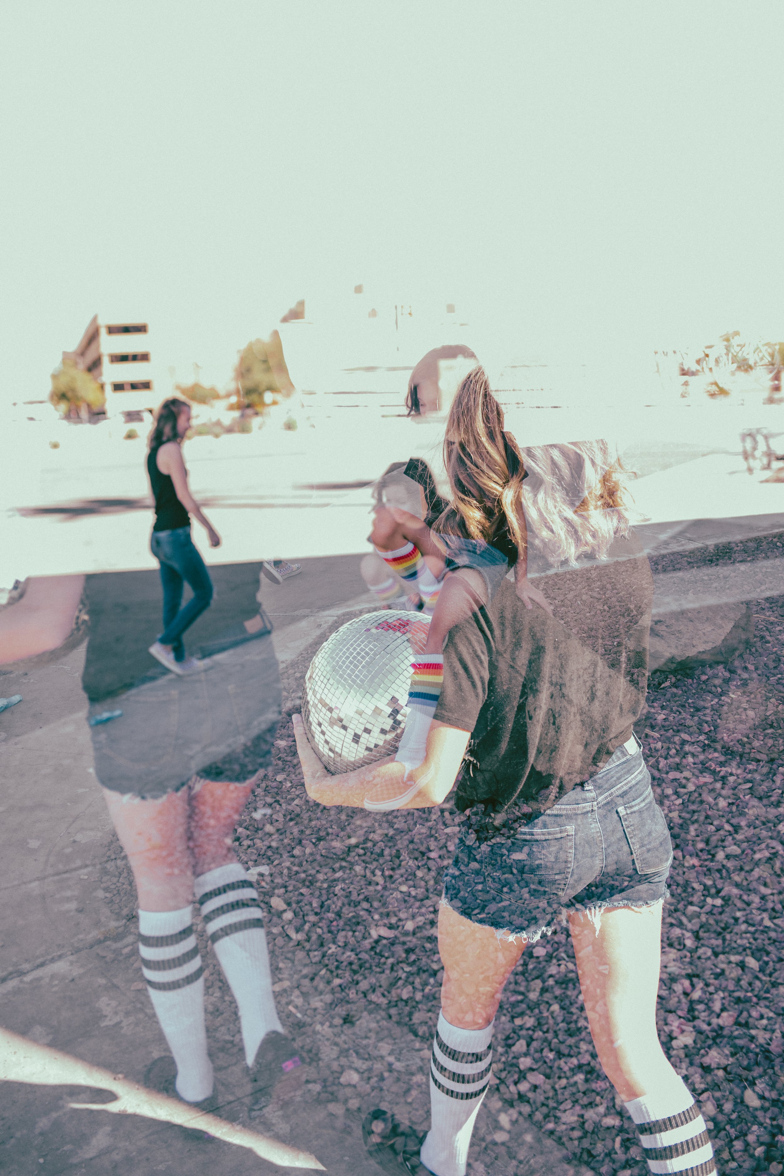 Double Exposure of Kids posing for their retro bike and skateboard photoshoot at Bowlero in Phoenix, Arizona by creative family photographer; Jennifer Lind Schutsky.