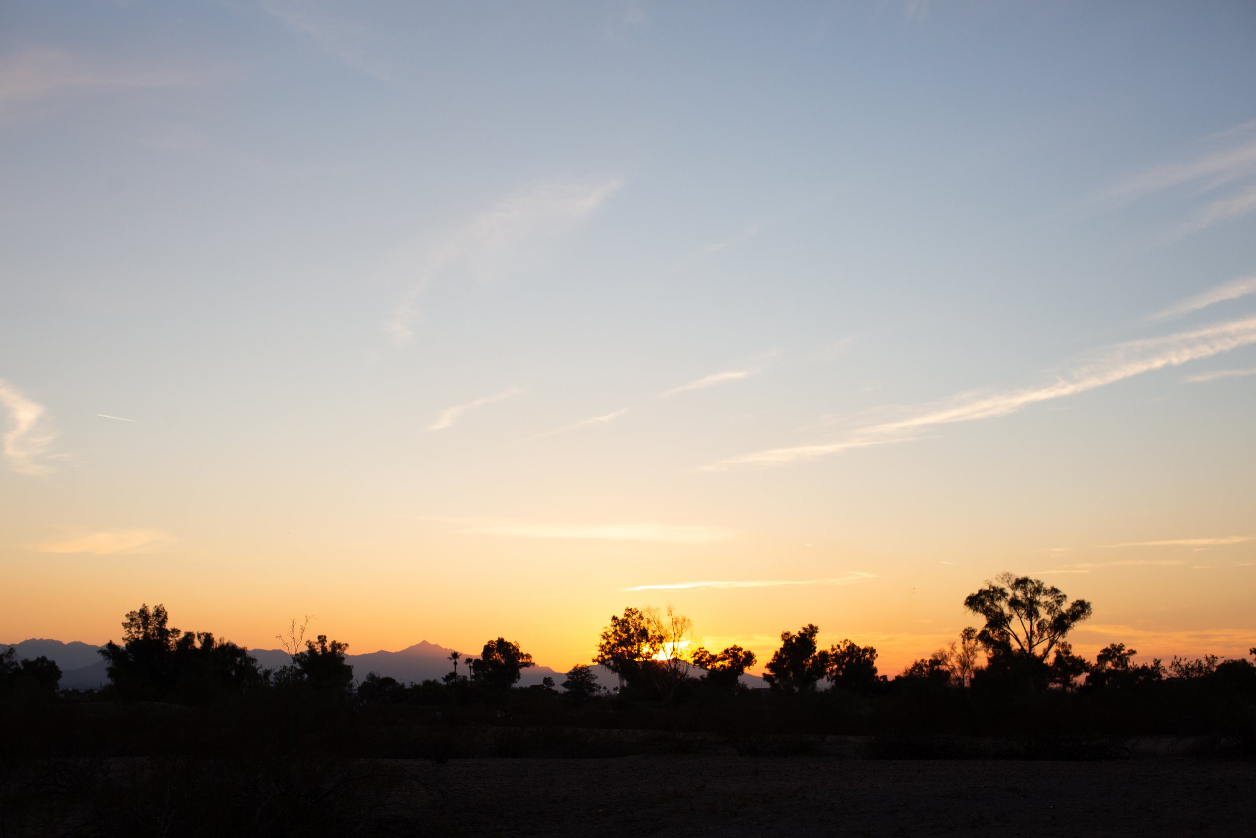 The sky during sunset at family desert photo session near Papago Park in Tempe, Arizona by Phoenix based family photographer Jennifer Lind Schutsky. 