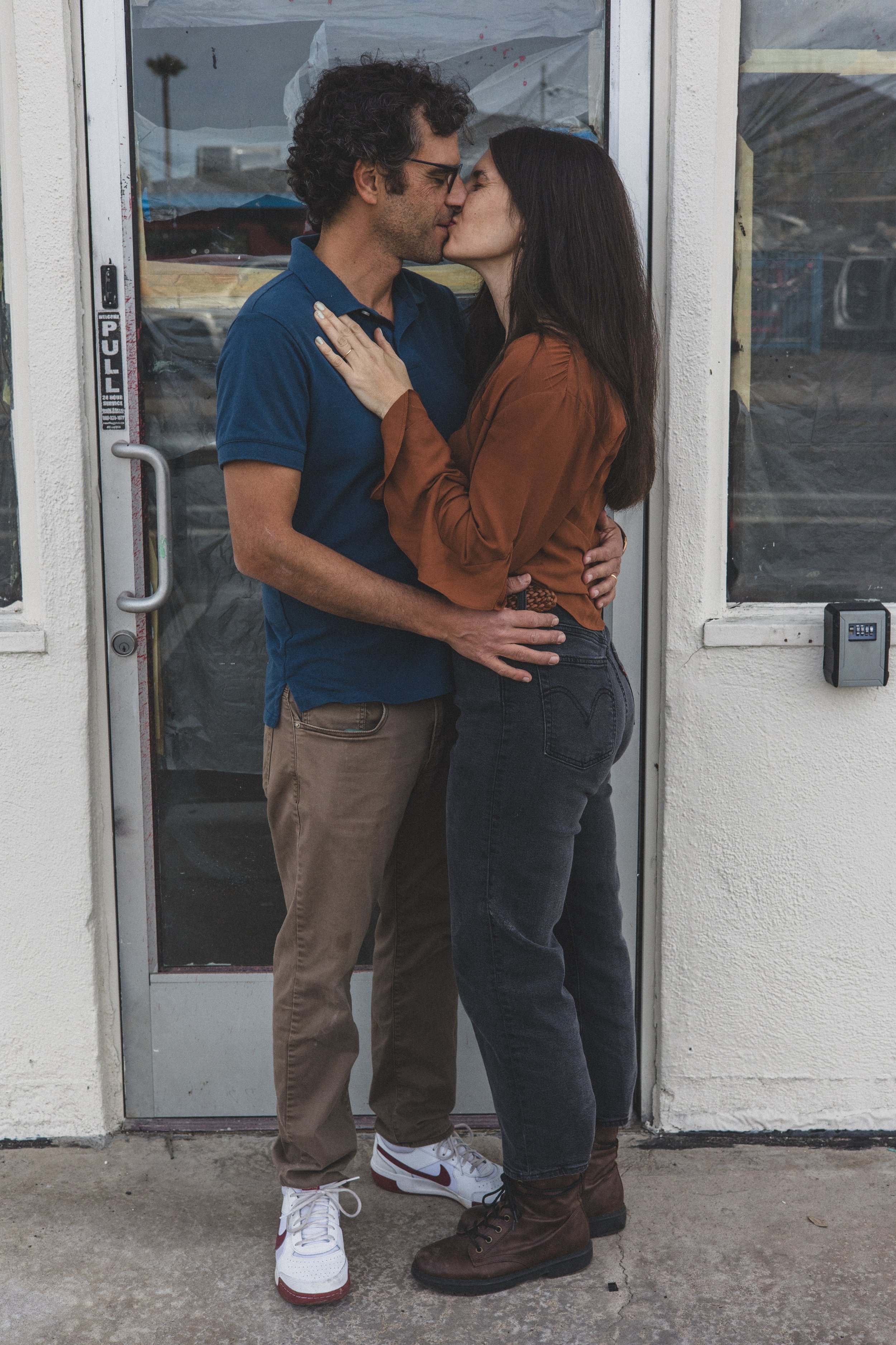 Couple poses in front of the Beal Beans’ new coffee shop coming to Sunnyslope, AZ by best Phoenix family photographer, Jennifer Lind Schutsky. 