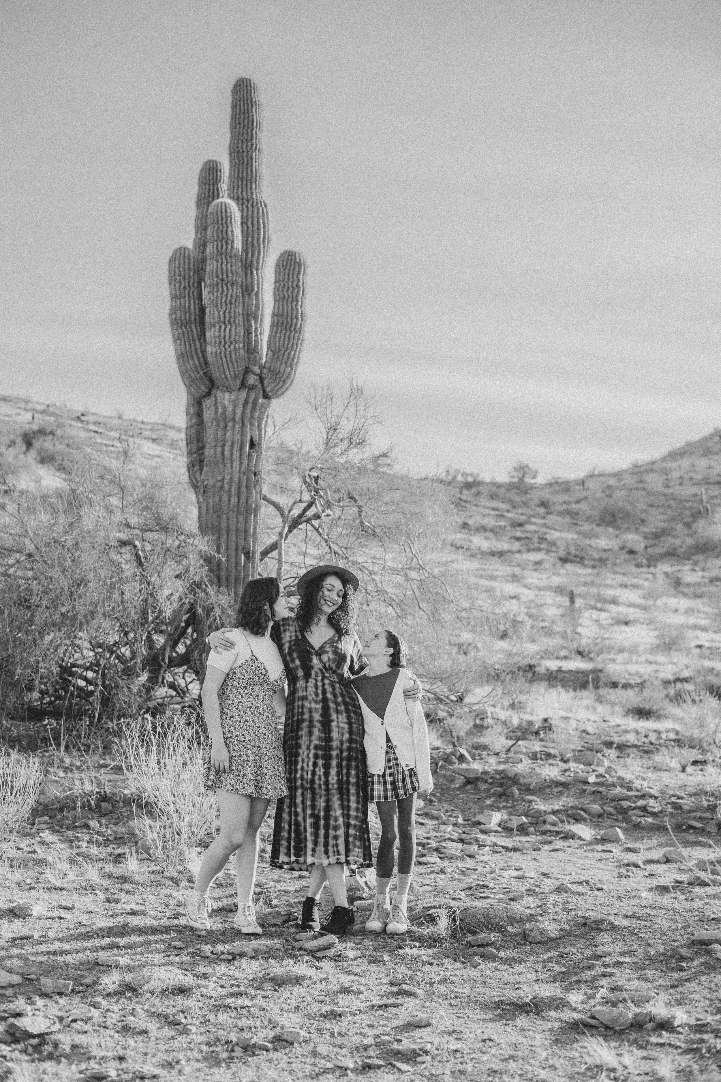 Women pose in front of saguaro cactus during their desert family photography session with Phoenix photographer, Jennifer Lind Schutsky.