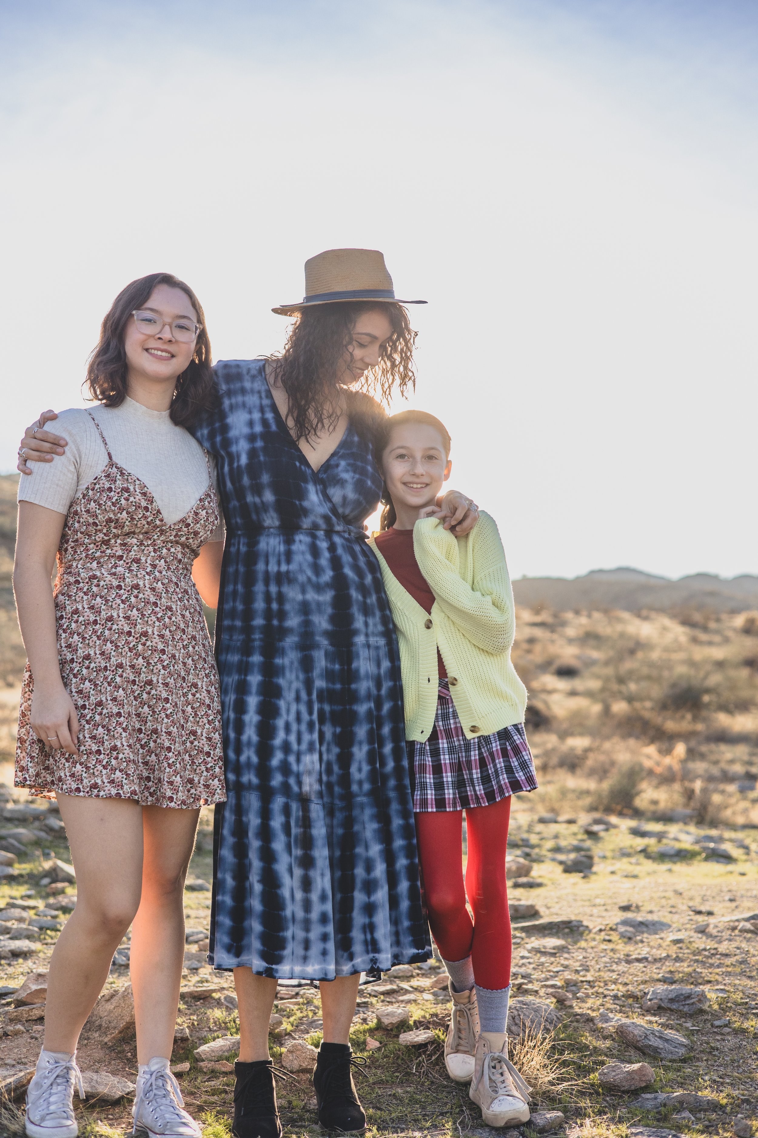 Woman and children pose during their lifestyle, desert family photography session with Phoenix photographer, Jennifer Lind Schutsky.