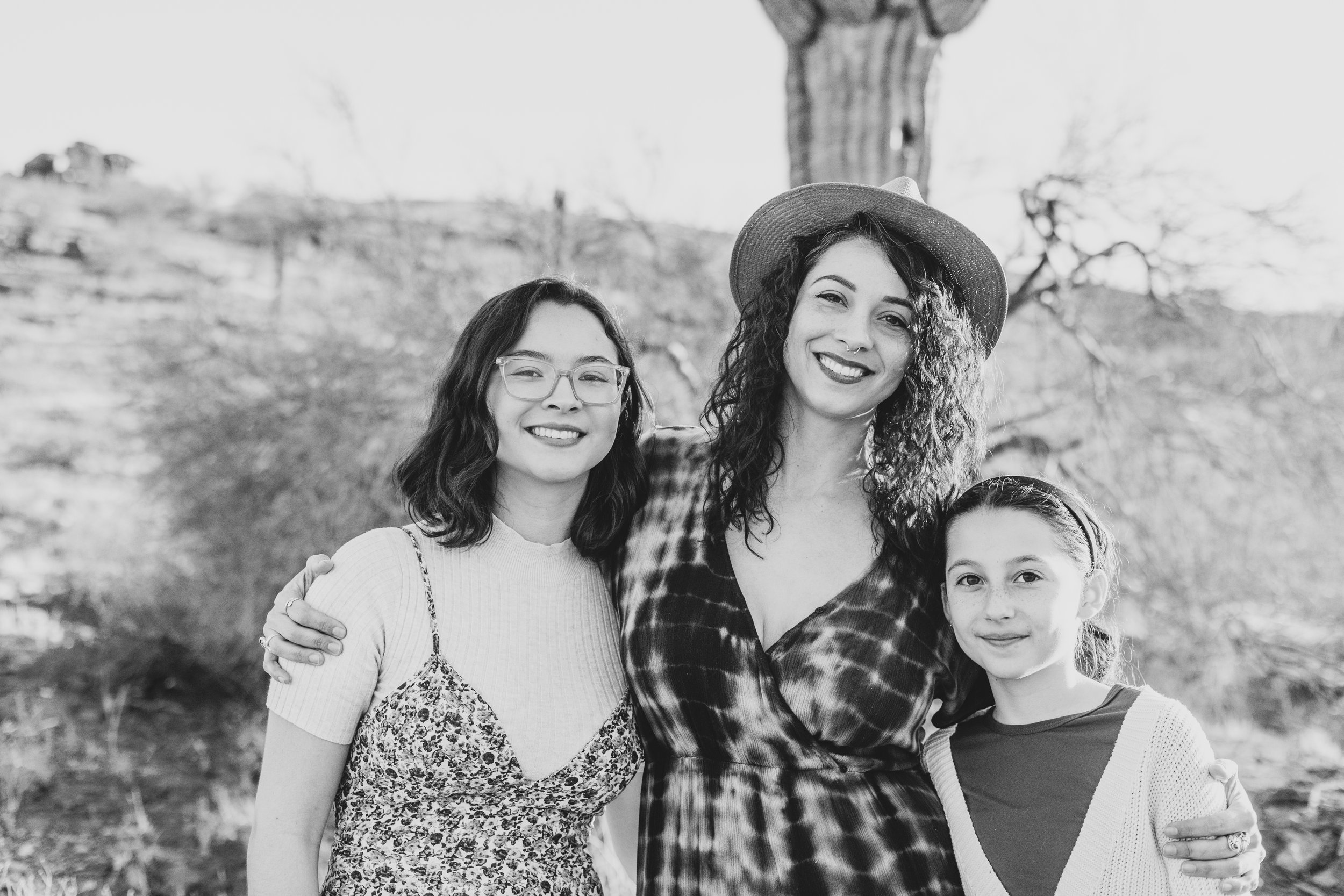 Women pose in front of saguaro cactus during their desert family photography session with Phoenix photographer, Jennifer Lind Schutsky.