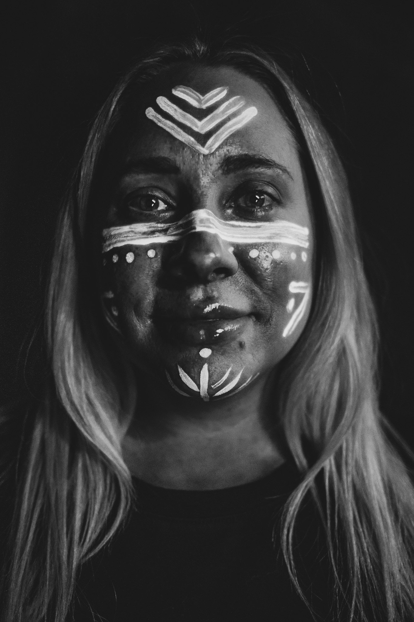 Woman poses with trendy, geometric neon body paint on their face for alternative neon body painting creative photoshoot by phoenix body artist, La Luna Henna and photographer Jennifer Lind Schutsky.