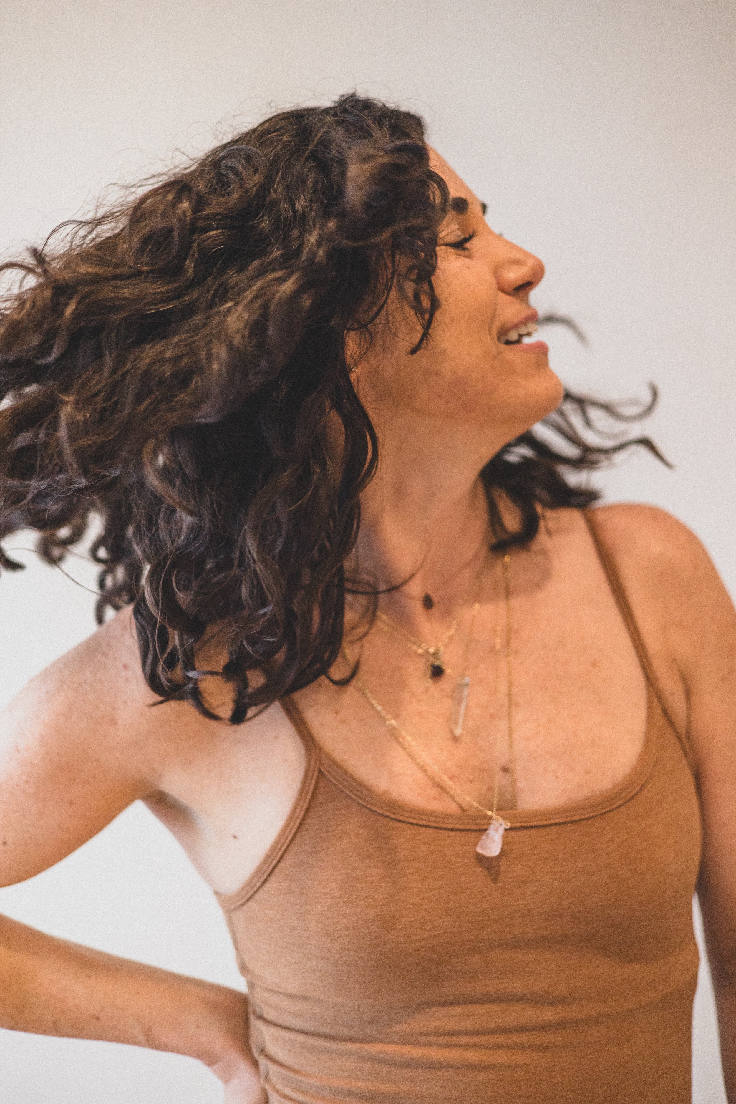 Woman poses before sound healing ceremony with crystal sound bowls at The Portal AZ in Scottsdale, with Phoenix based lifestyle branding photographer, Jennifer Lind Schutsky.