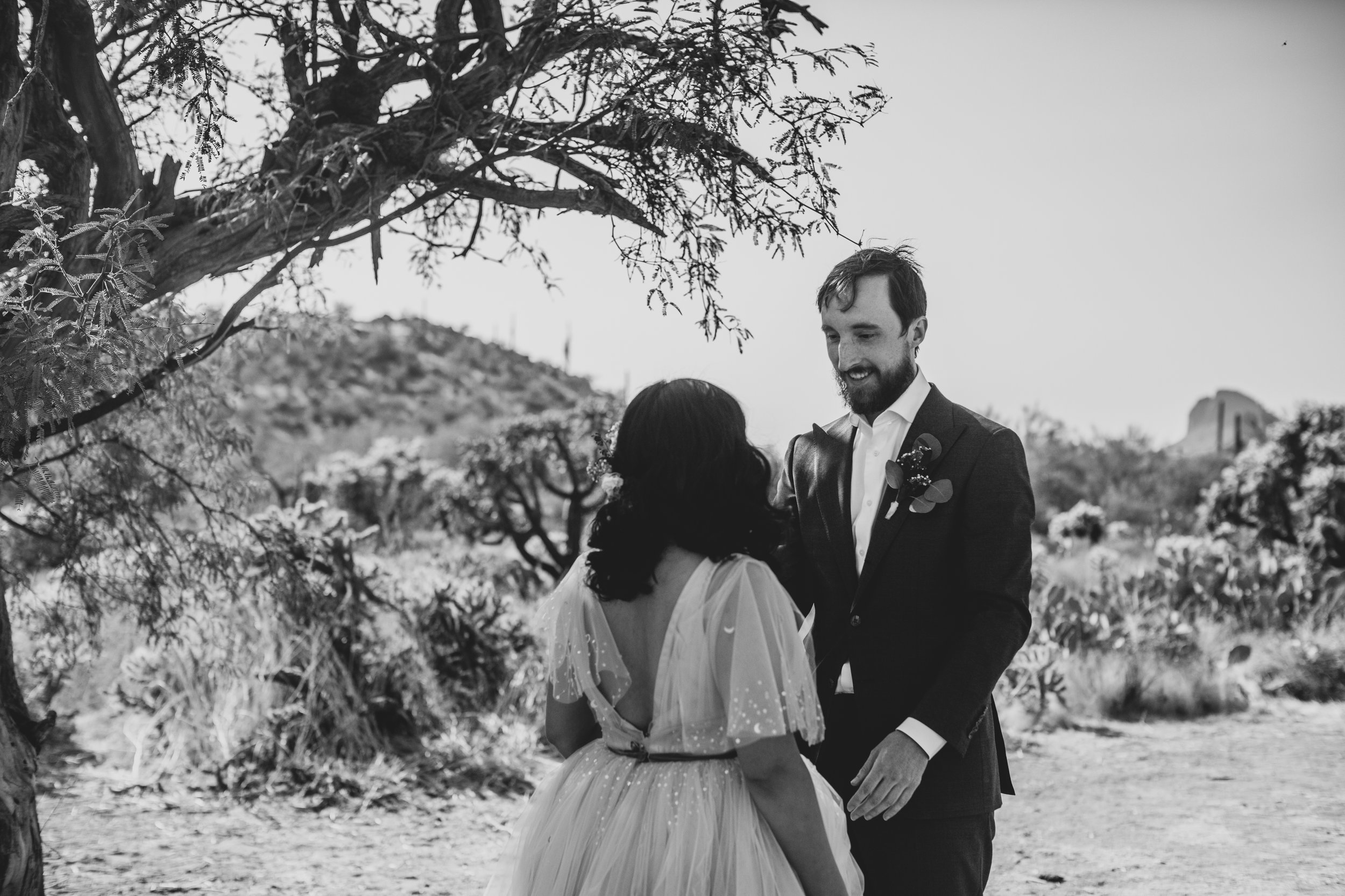 Bride and Groom share intimate sneak peek at their Superstition Mountain intimate wedding in Arizona by outdoor wedding photographer, Jennifer Lind Schutsky. 