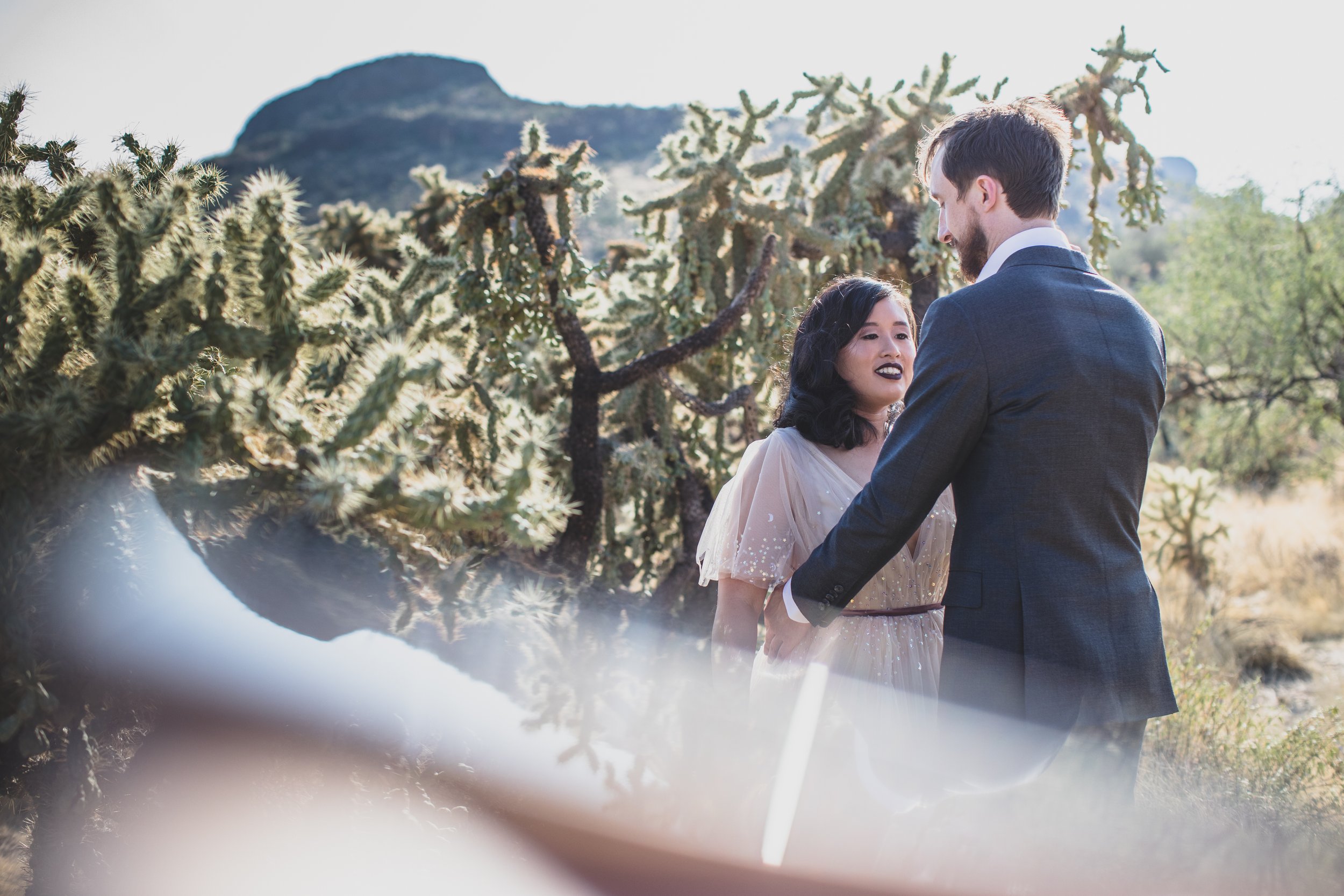 Bride and Groom share intimate sneak peek at their Superstition Mountain intimate wedding in Arizona by outdoor wedding photographer, Jennifer Lind Schutsky. 