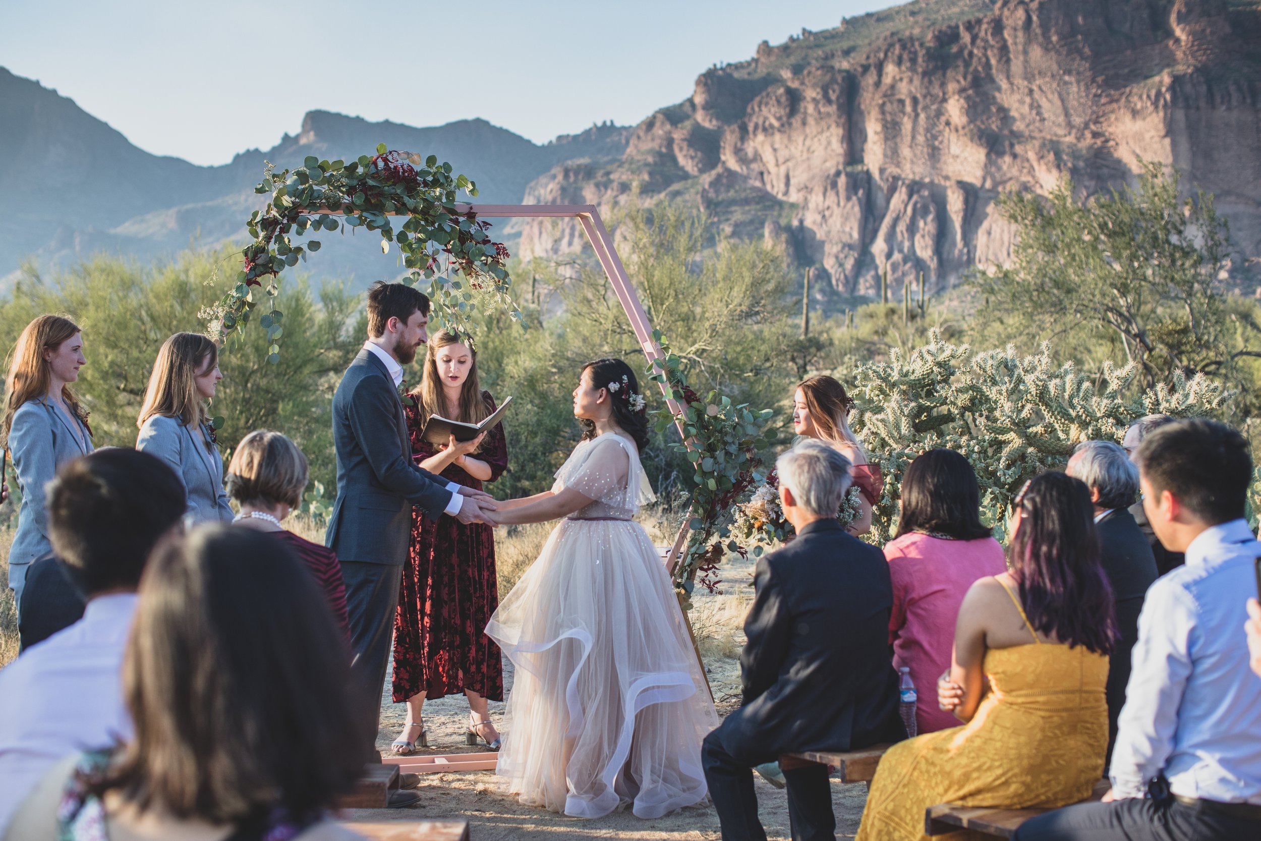 Bride and Groom share handwritten vows at their intimate Superstition Mountain micro wedding in Arizona by experienced wedding photographer, Jennifer Lind Schutsky. 