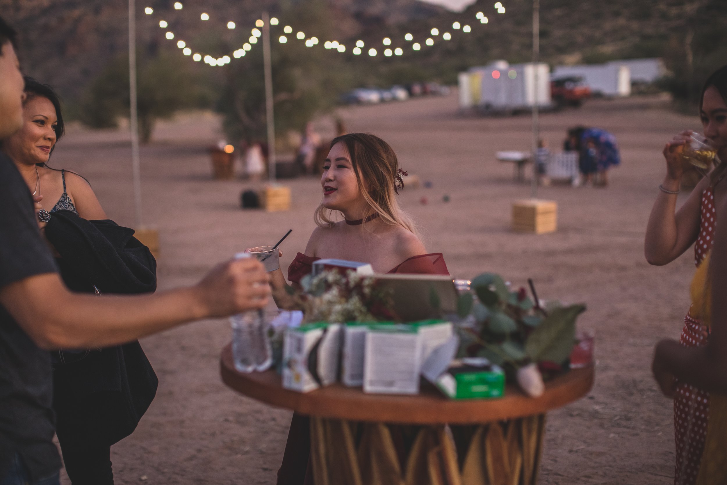 Guests mingle at the reception after intimate Superstition Mountain micro wedding near Phoenix, Arizona by wilderness wedding photographer, Jennifer Lind Schutsky. 