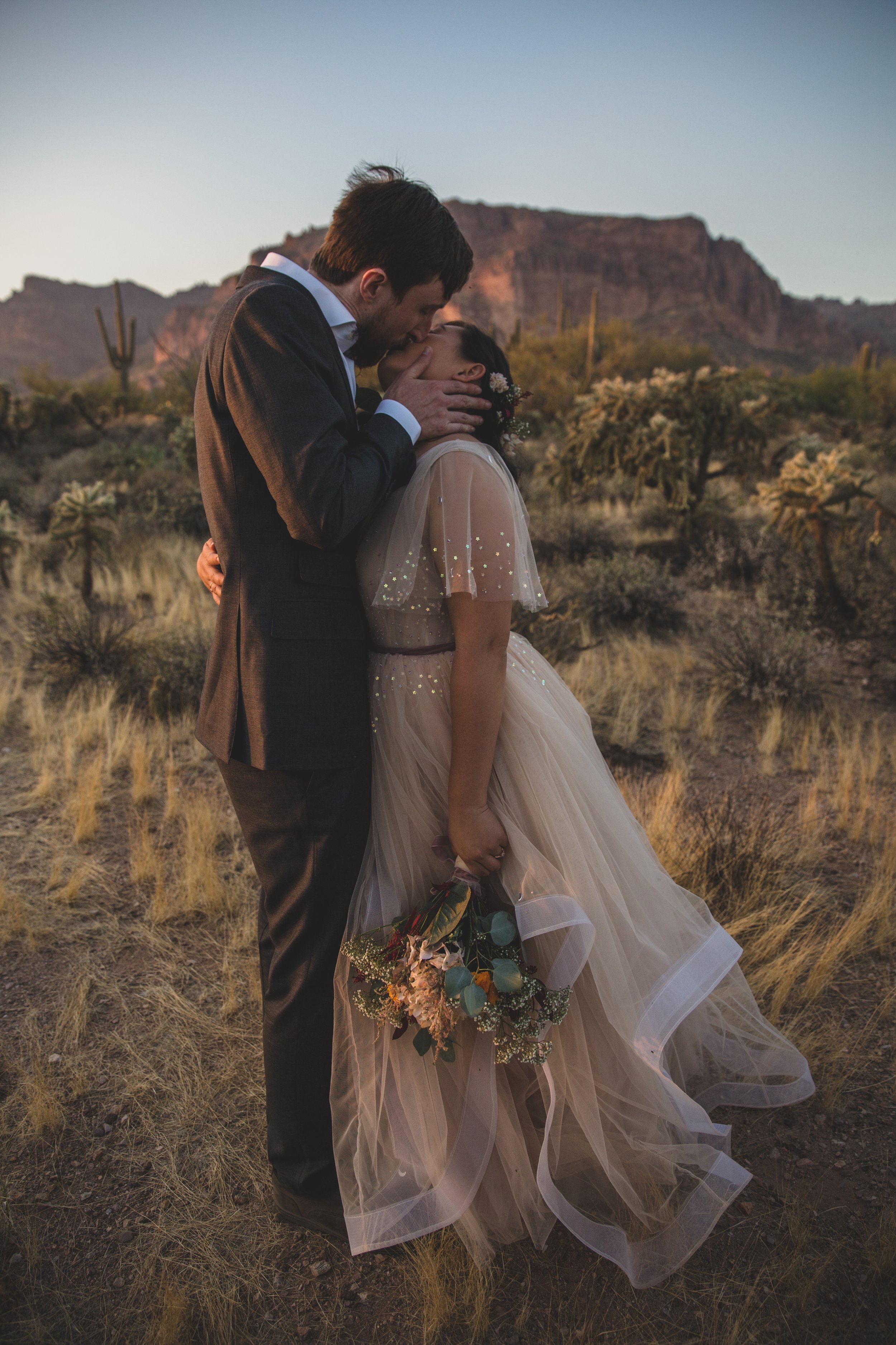 Details of handmade wedding dress for couple’s intimate Superstition Mountain micro wedding in  rural Arizona by destination wedding photographer, Jennifer Lind Schutsky. 