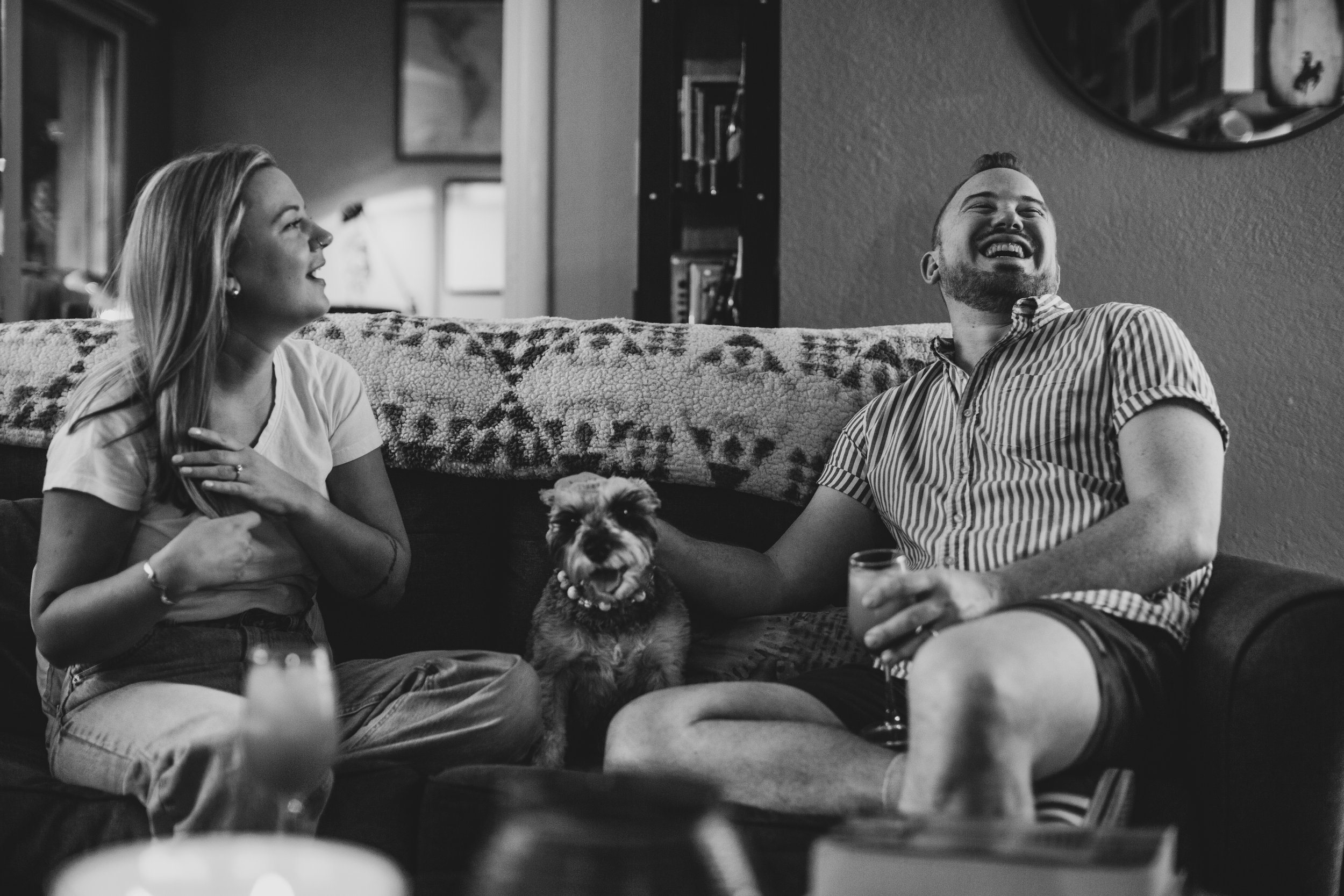 Couple have fun together during their in-home engagement photo session with Phoenix based romantic and creative wedding photographer; Jennifer Lind Schutsky. 