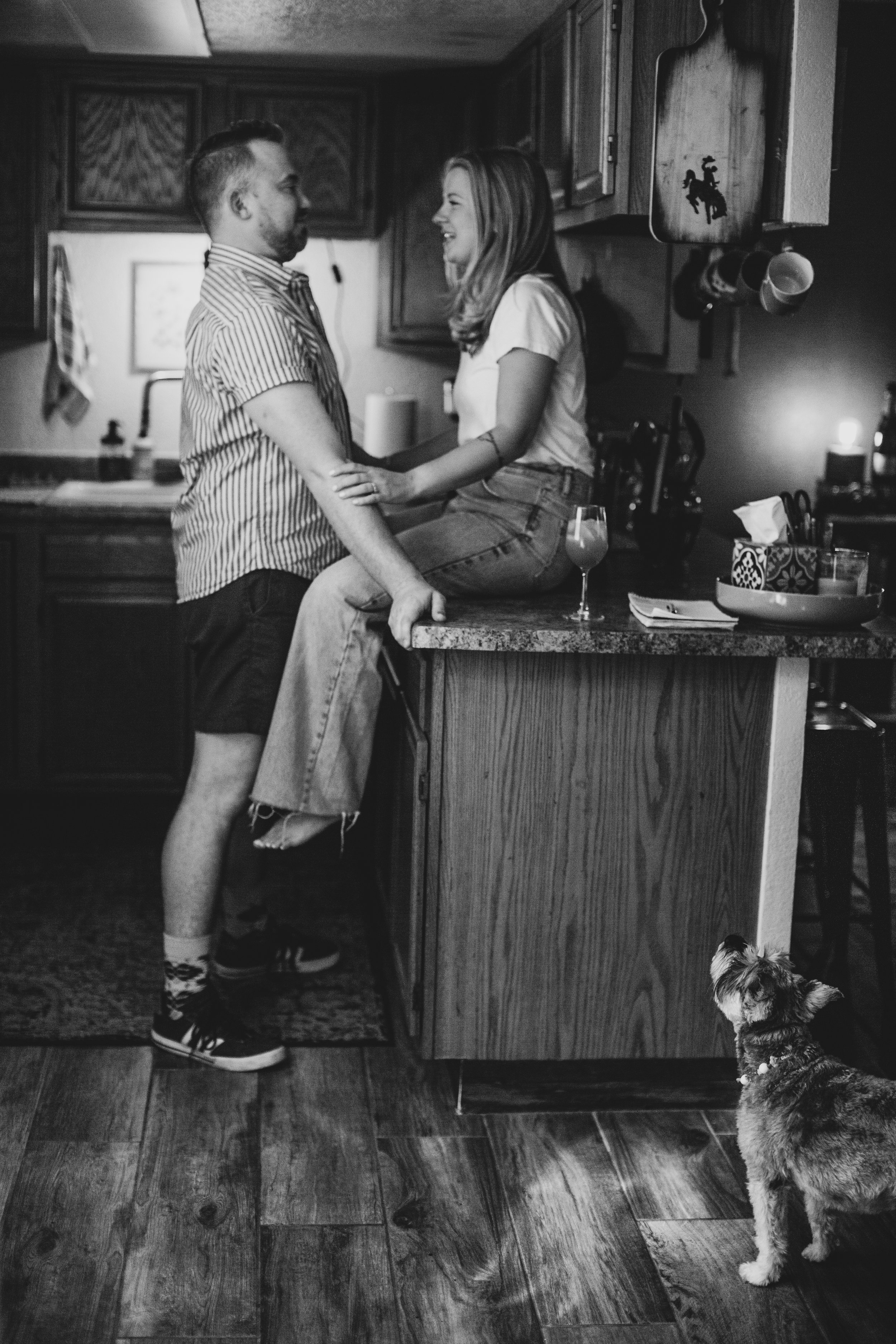 Couple have fun together during their in-home engagement photo session with Phoenix based romantic and creative wedding photographer; Jennifer Lind Schutsky. 