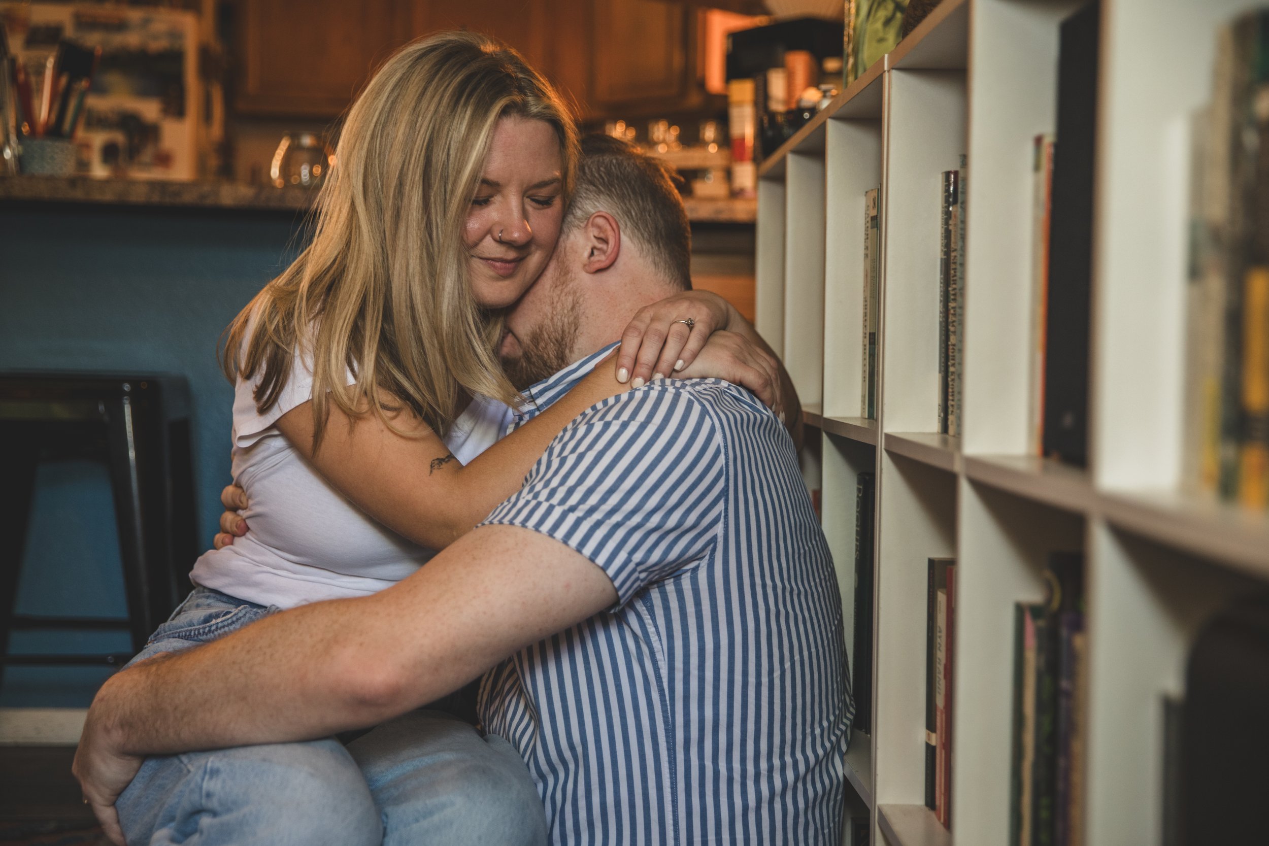 Couple get cozy and intimate during their in-home engagement photo session with Phoenix based romantic and creative wedding photographer; Jennifer Lind Schutsky. 